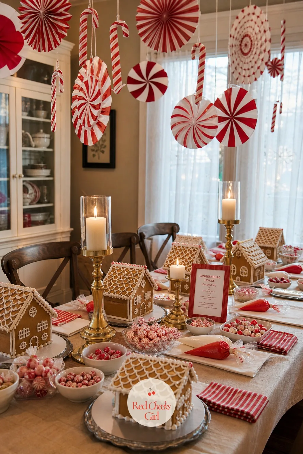 Peppermint Pinwheel And Candy Cane Garland Overhead — Look up before anyone sits down: the thing that makes the room read party and not kitchen table hangs