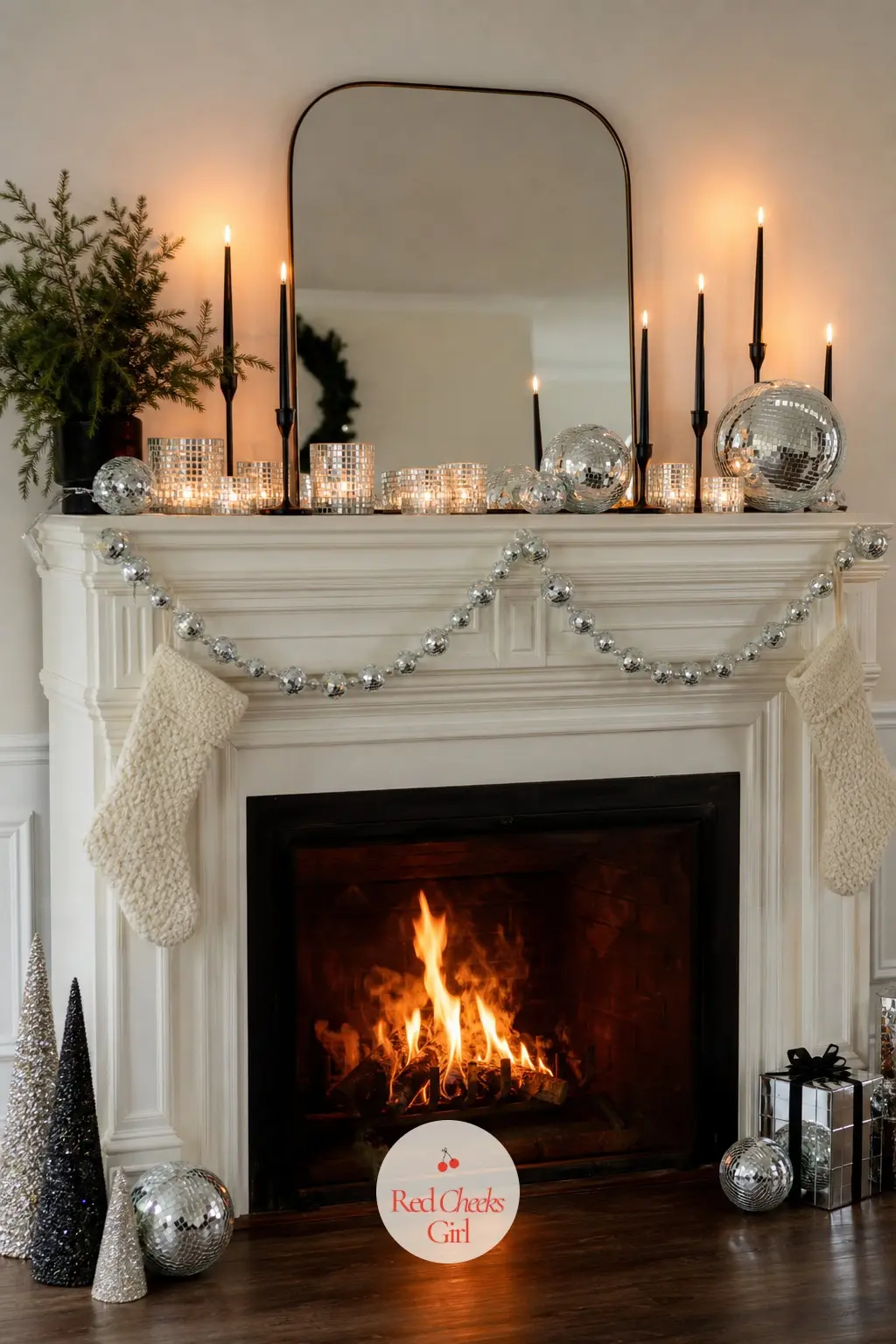 The Mantel, Lined in Mirror Tile and Candlelight — A row of mirror tile votive holders runs the length of the mantel, each one throwing the candle flame back