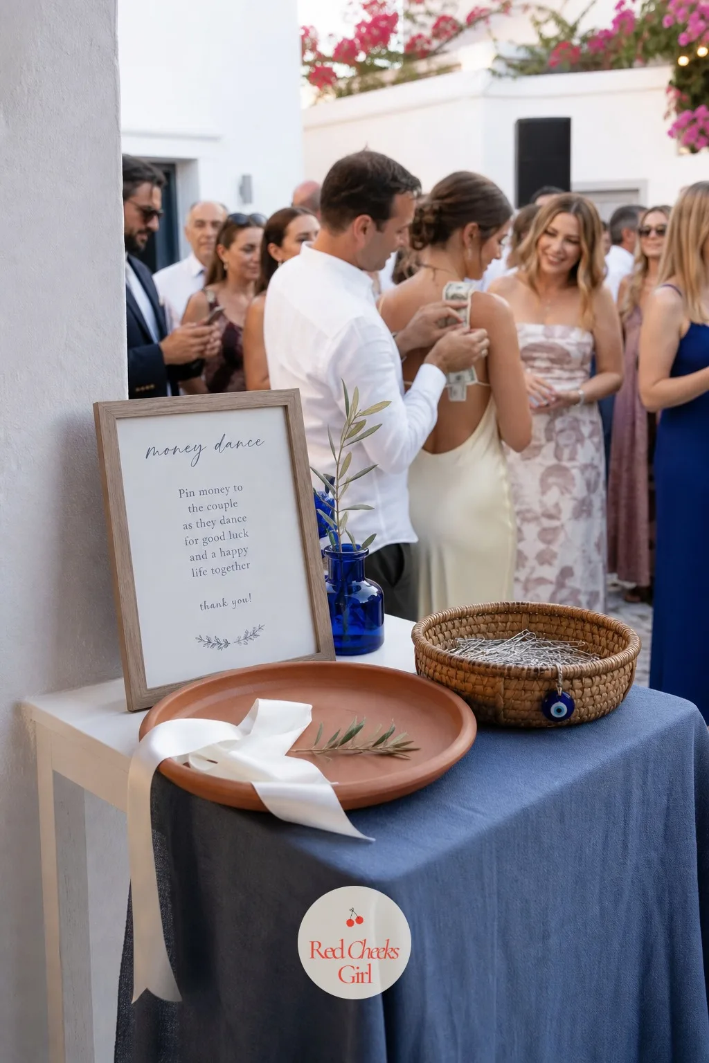 Money Pinning Dance Station — For guests who have never seen it, money suddenly appearing on the bride and groom mid-dance looks chaotic in the best way. Greek