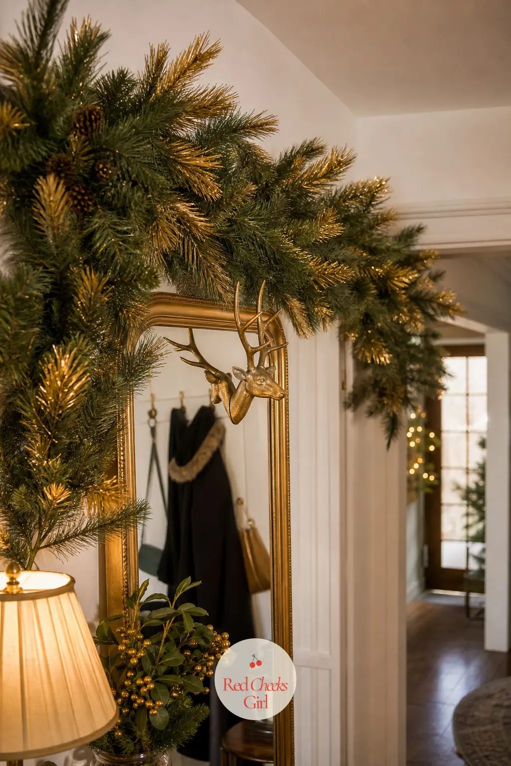 The Entrance Hall, Hung with 9 Feet of Gold-Cuffed Pine Garland — Just inside the door, a garland with the tips dipped in gold does the work a whole tree