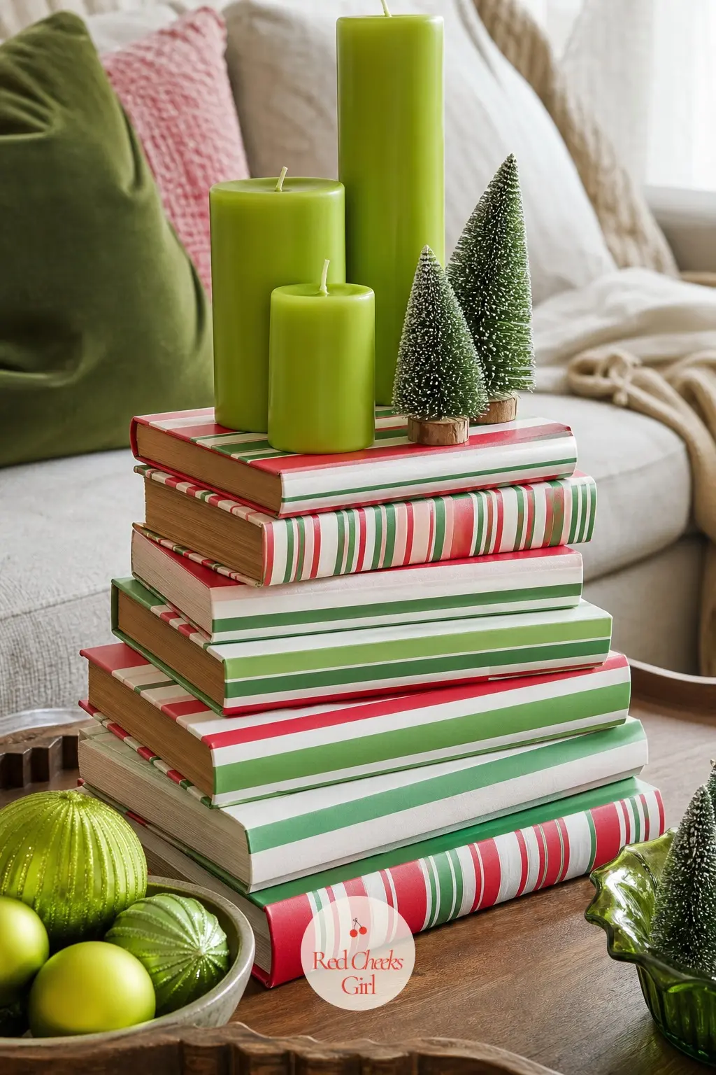 The Coffee Table Stacked a Little Too High — A stack of books wrapped in striped paper instead of their usual jackets, a trio of lime candles at different
