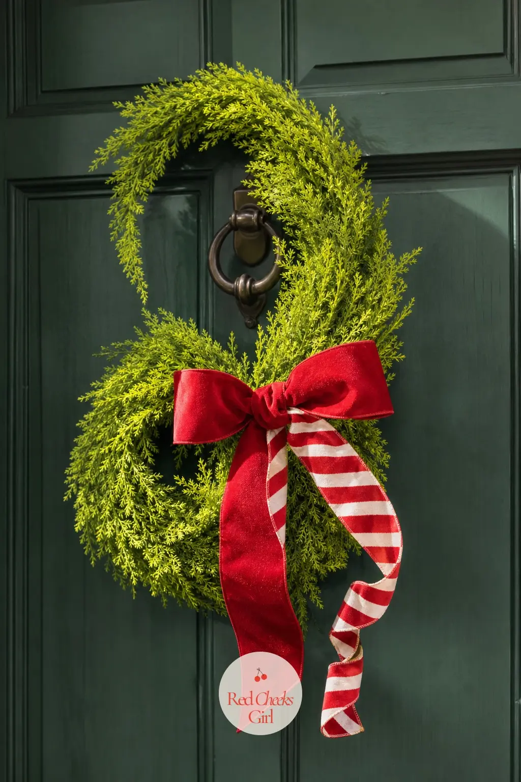 A Crooked Wreath for the Front Door — A lime green wreath base with a cherry red velvet bow tied slightly off-centre, one white-striped ribbon tail curling