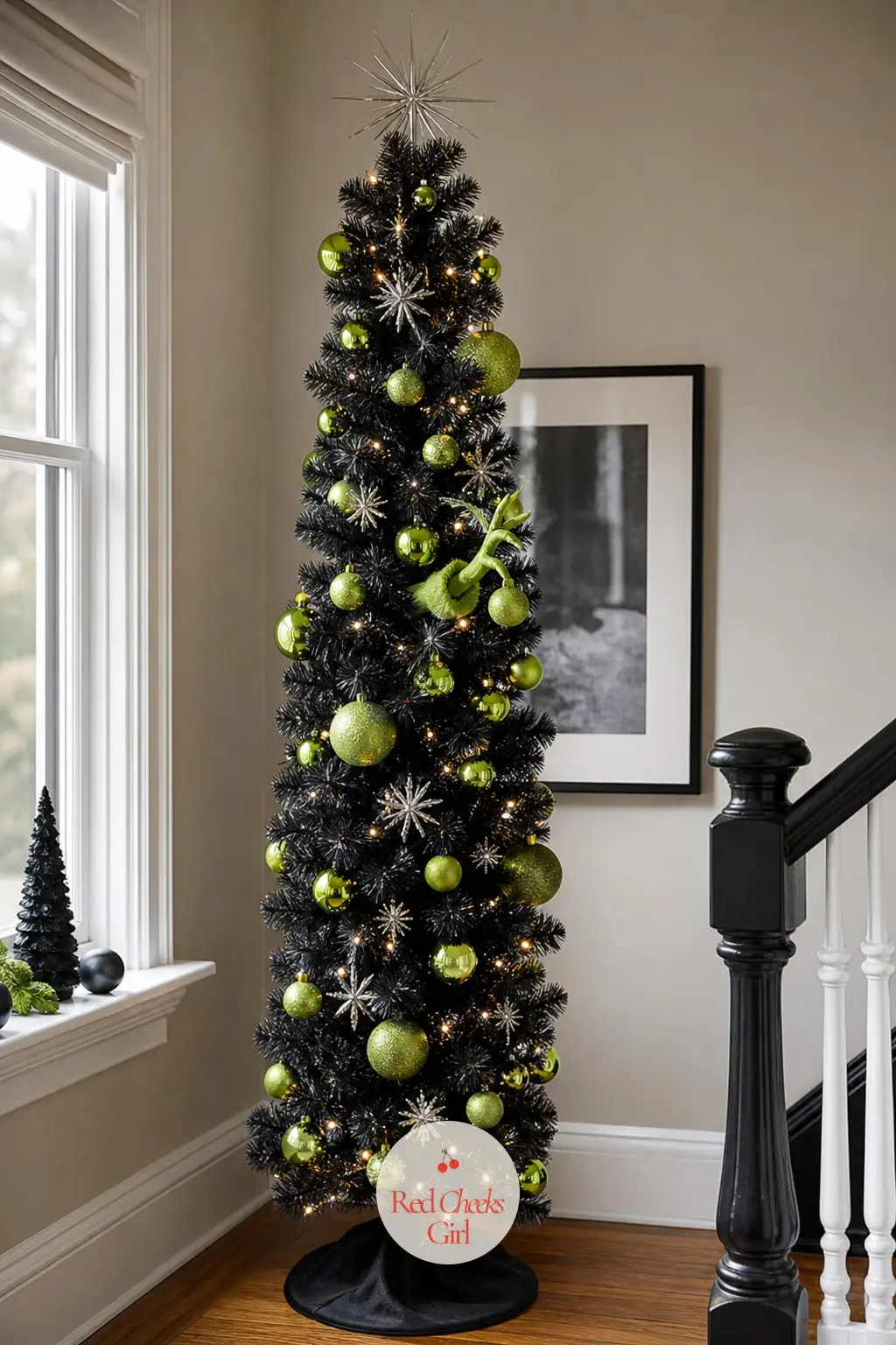 A Slim Black Pencil Tree for a Moody Lair — A slim pencil artificial tree in black, narrow enough for a tight landing or stairwell, with lime green and silver