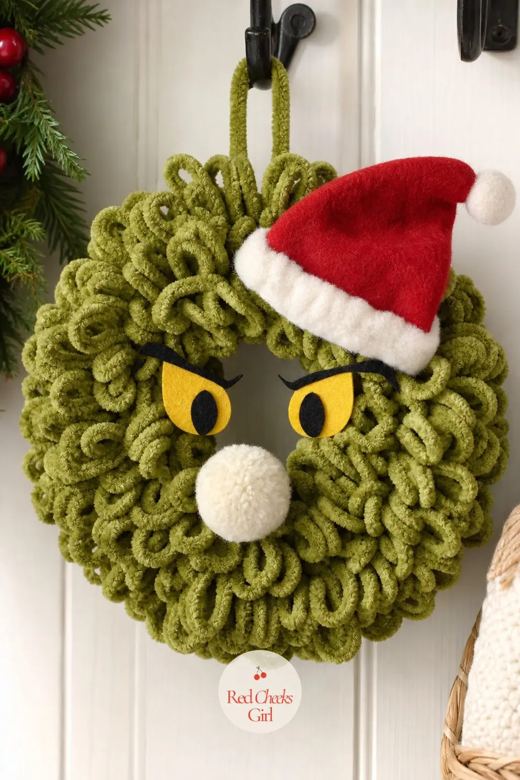 A Curly Chenille Yarn Grinch Face Wreath for the Mudroom Hook — Chenille yarn wrapped and looped around a wire form builds a softer, fuzzier face than fur