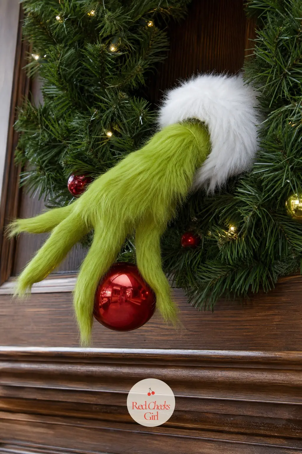 A Furry Green Grinch Hand Wreath Stealing a Red Ornament for the Family Room Mantel — Skip the face and go straight to the gesture. Grinch wreath ideas