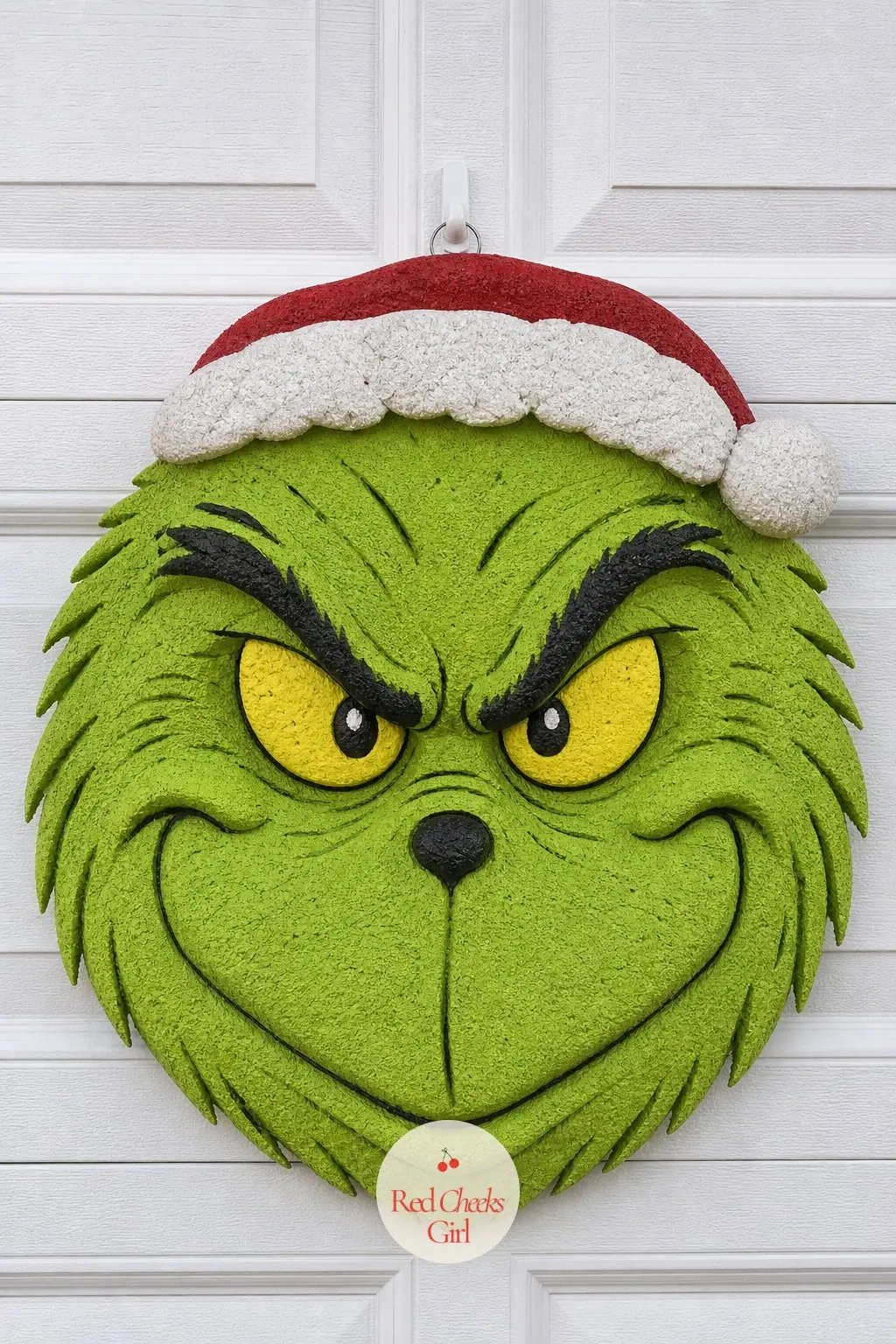 A Sculpted Styrofoam Grinch Face Wreath for the Garage Door — No fur at all here. Grinch wreath ideas