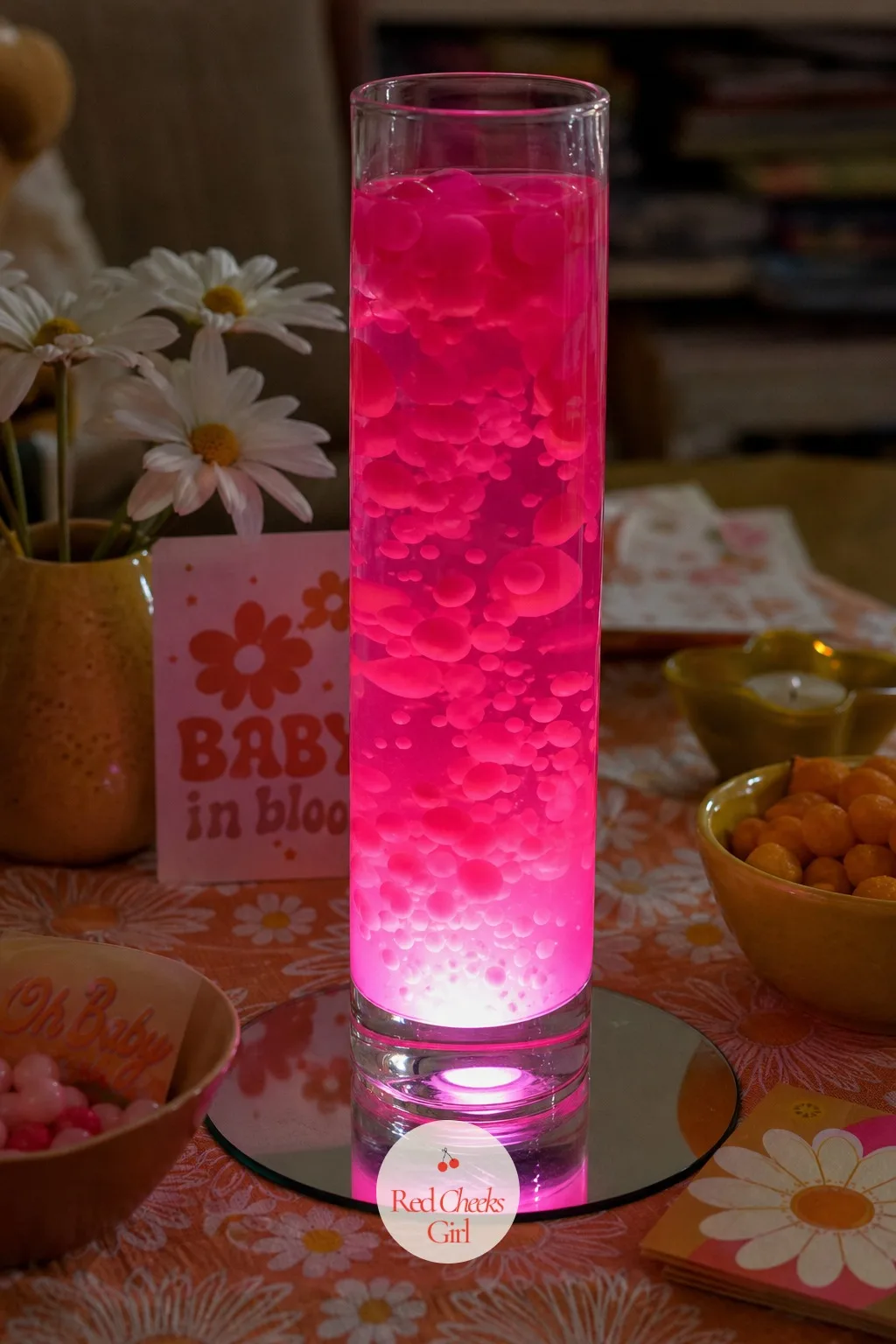 Lava-Lamp Glow Centerpiece — A table full of flowers alone can start to look like every other party. Groovy baby shower ideas