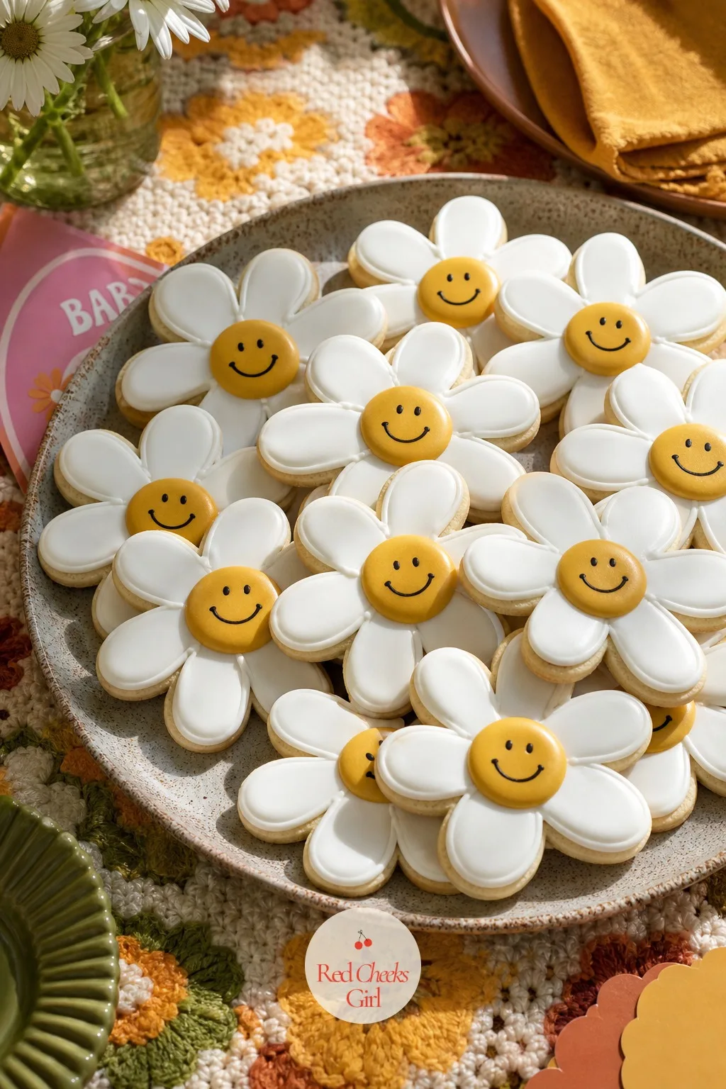 Smiley Flower Cookies — Nothing on a dessert table gets picked up and photographed faster than a cookie with a face on it. Groovy baby shower ideas