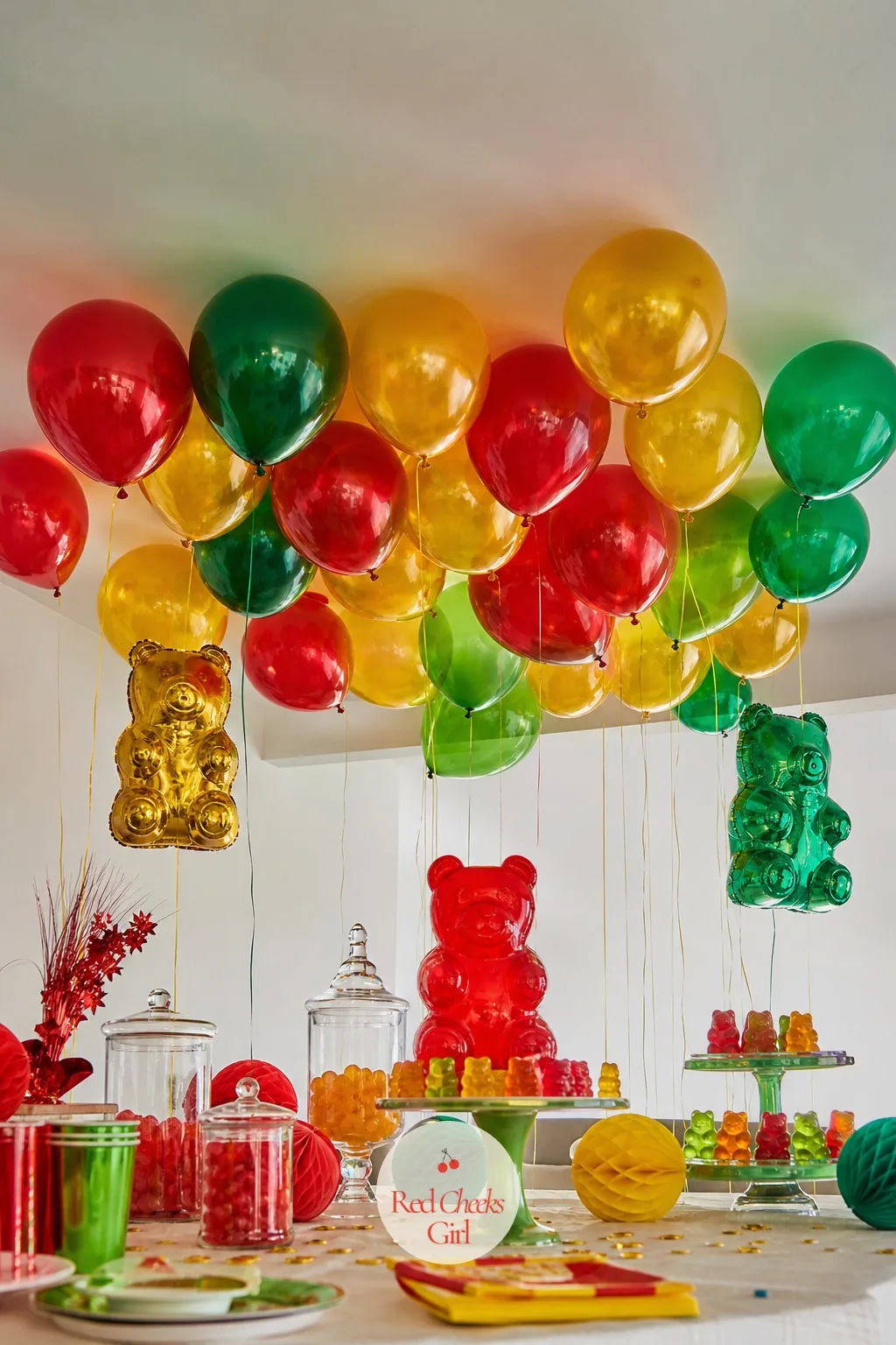 Jelly-Toned Balloon Ceiling Cloud — A ceiling feels bare in photos long after the table is finished, so add volume overhead instead of across it. Gummy bear