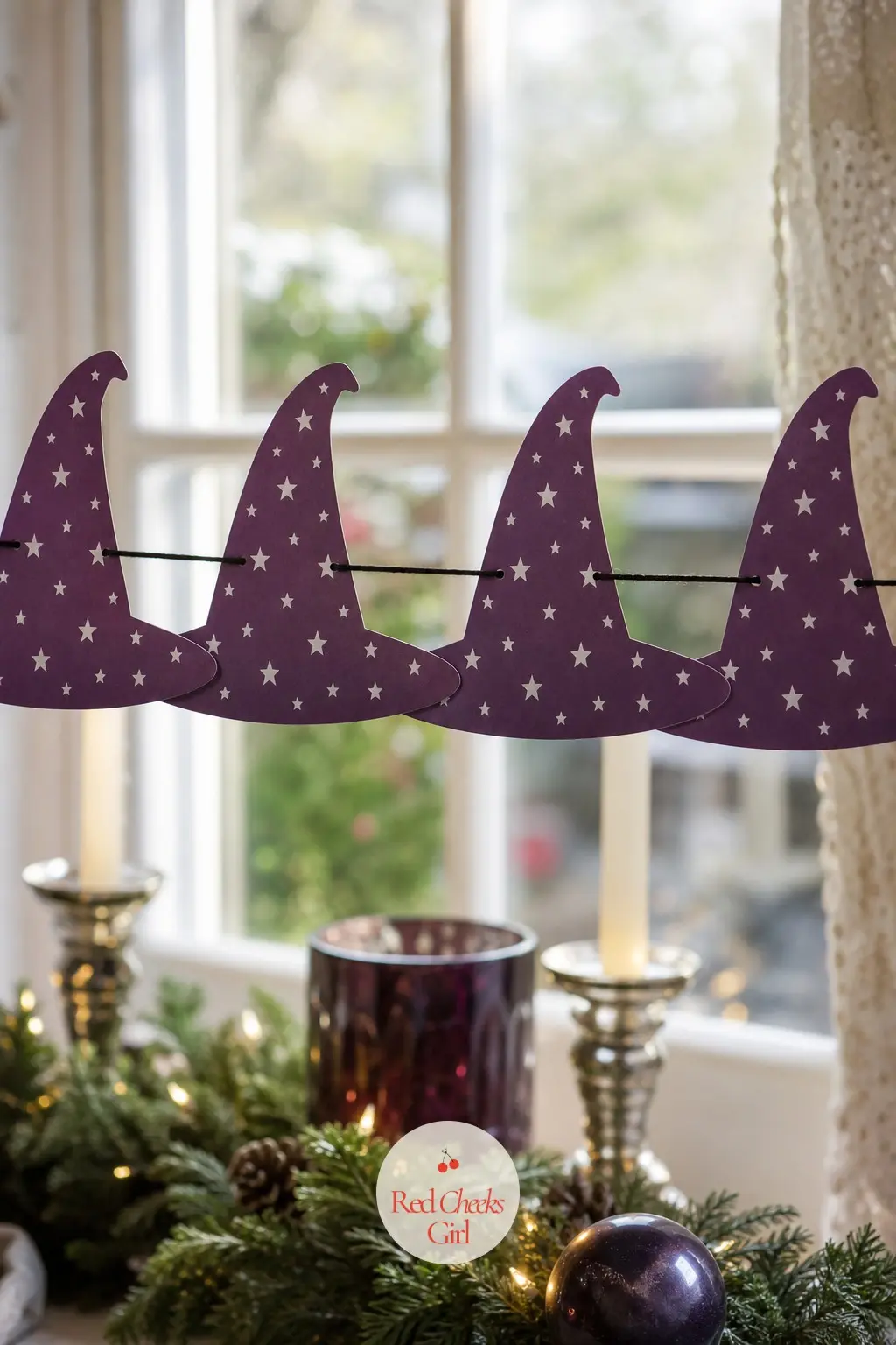 Pointed Wizard Hat Garland — A tall cone shaped hat in deep plum with a scattering of small silver stars and a thin wide brim, this garland works best as a