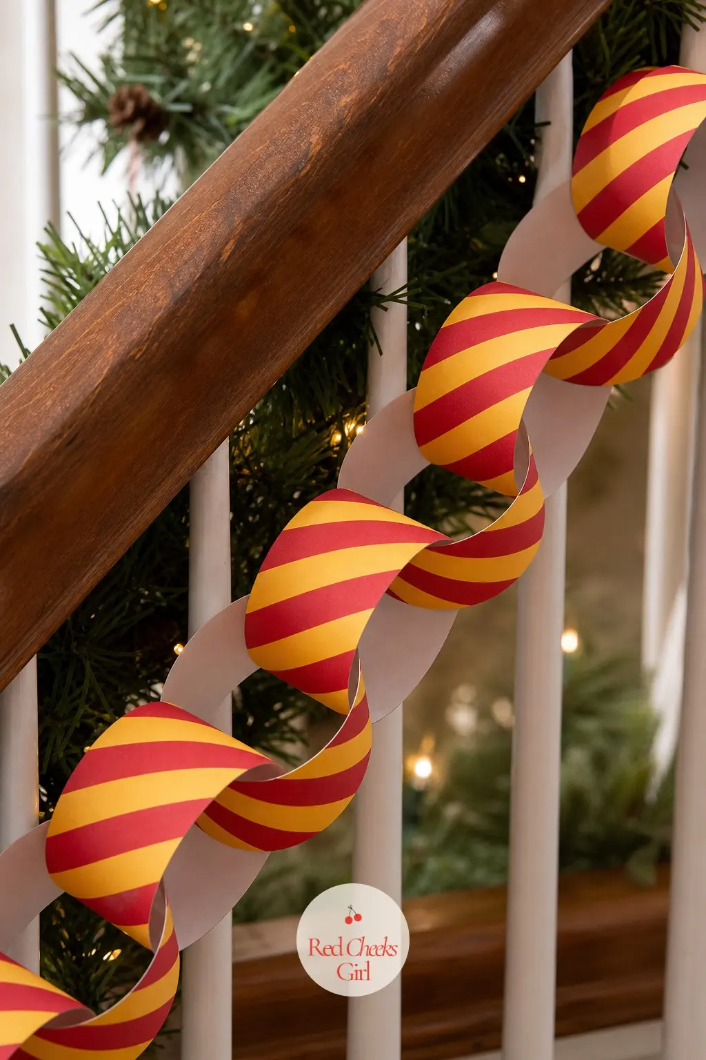Scarlet and Gold Striped Chain — This is a straightforward candy stripe paper chain in scarlet and gold, the kind that wraps a banister or frames a doorway the