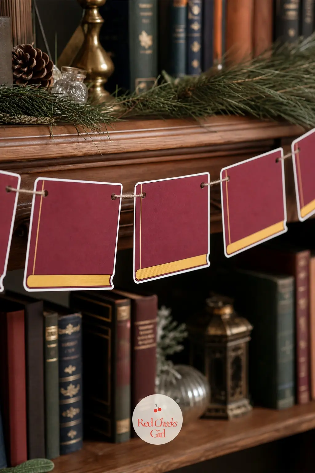 Spellbook Garland — A closed leather bound book in deep burgundy with a thin gold edge along the spine and pages, this garland suits a bookshelf, a study