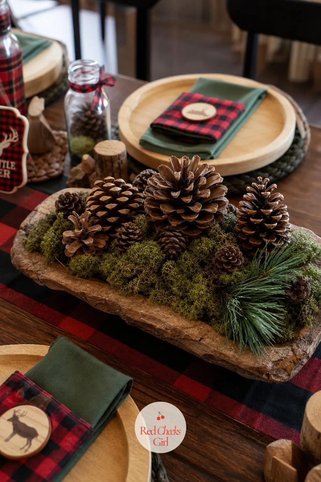 Moss And Pinecone Arrangement — The antlers carry the drama, so something softer needs to fill the quiet stretches of the table or the room will feel staged