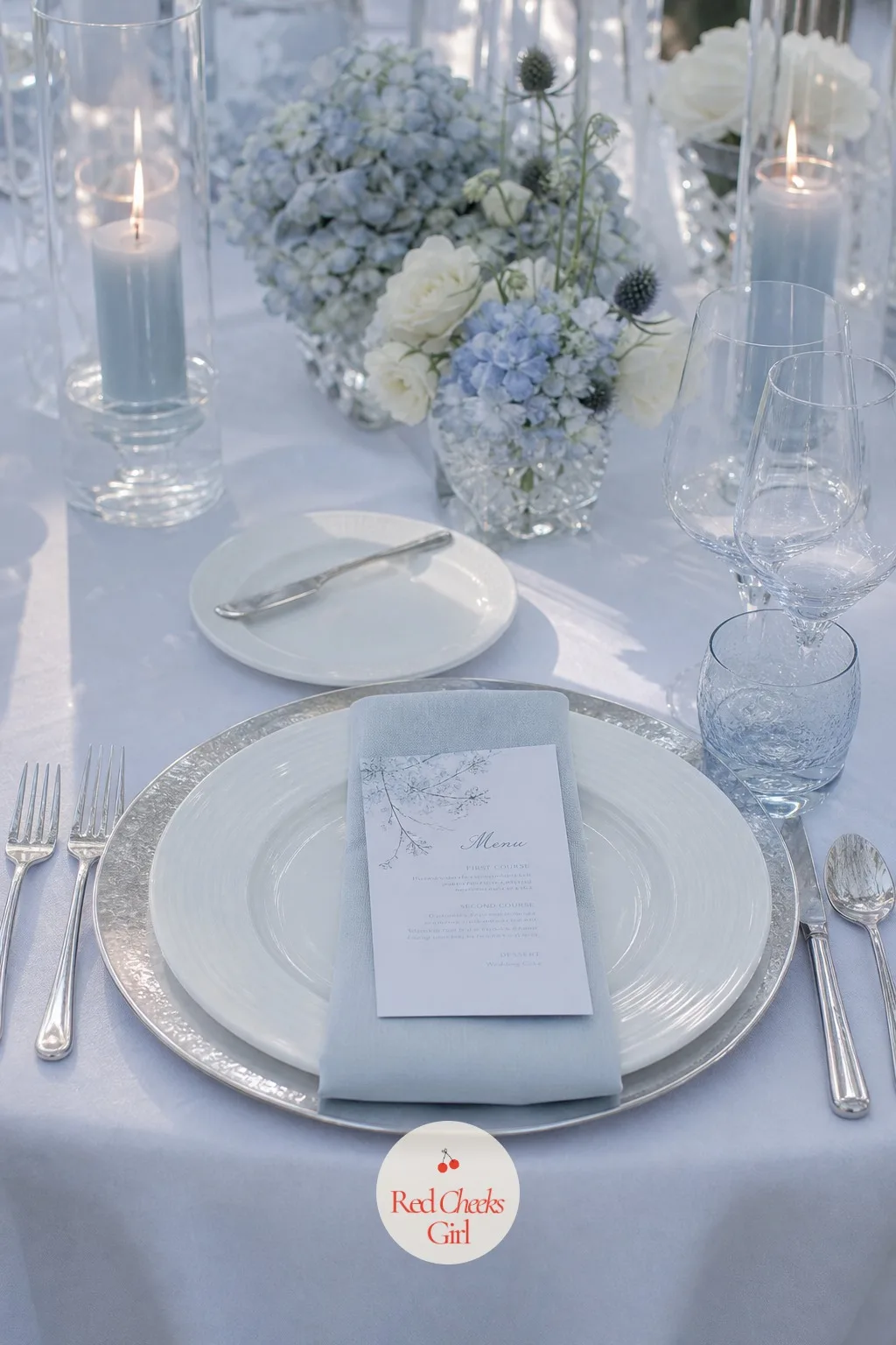 The Flatware and Chargers — The plate setting is what a guest looks down at between courses, and a plain white charger under a plain white plate reads flat in