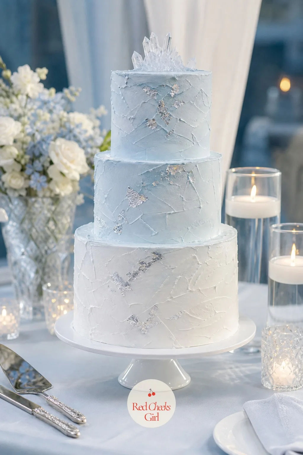 The Wedding Cake — A plain white tiered cake can look like it belongs at any wedding rather than this one. Ice blue wedding theme