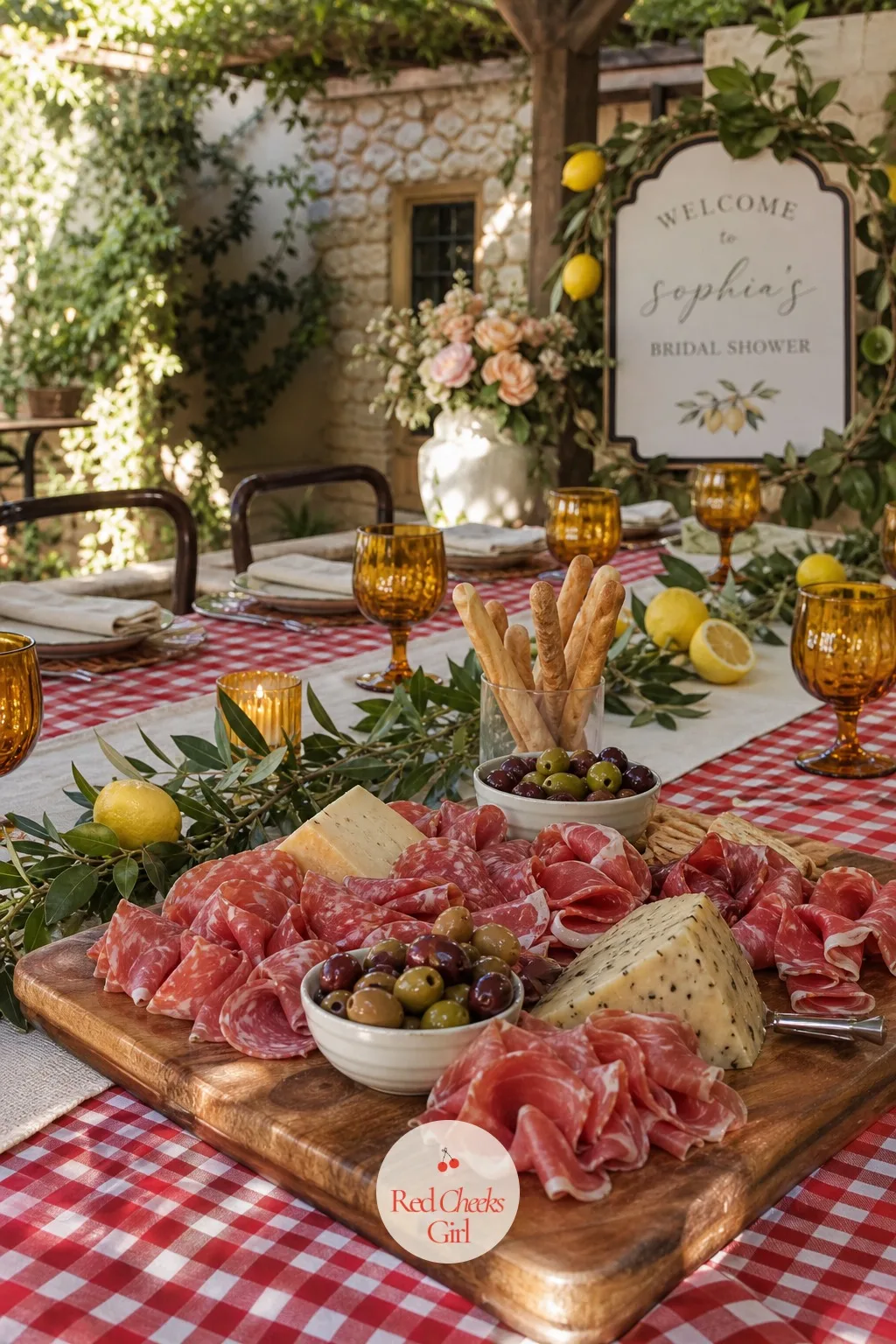 The Antipasto Board — This is the first plate anyone fills, so it sits at the center of the table or just beside it: wide wooden boards piled with cured meats