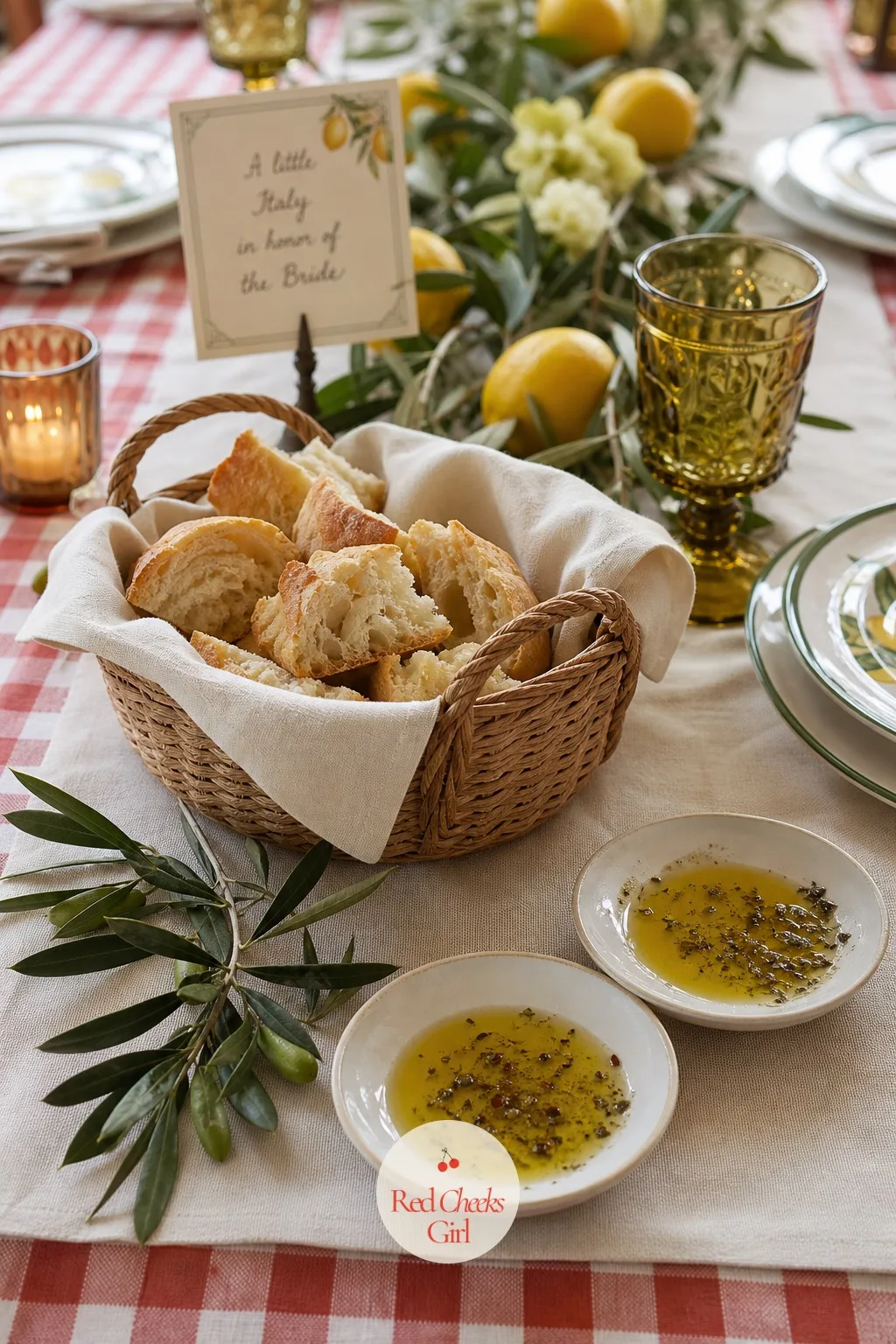 A Bread Basket With Flavored Olive Oil — Beside the boards, something warmer: a basket of torn bread with two small dishes of olive oil for dipping, one plain