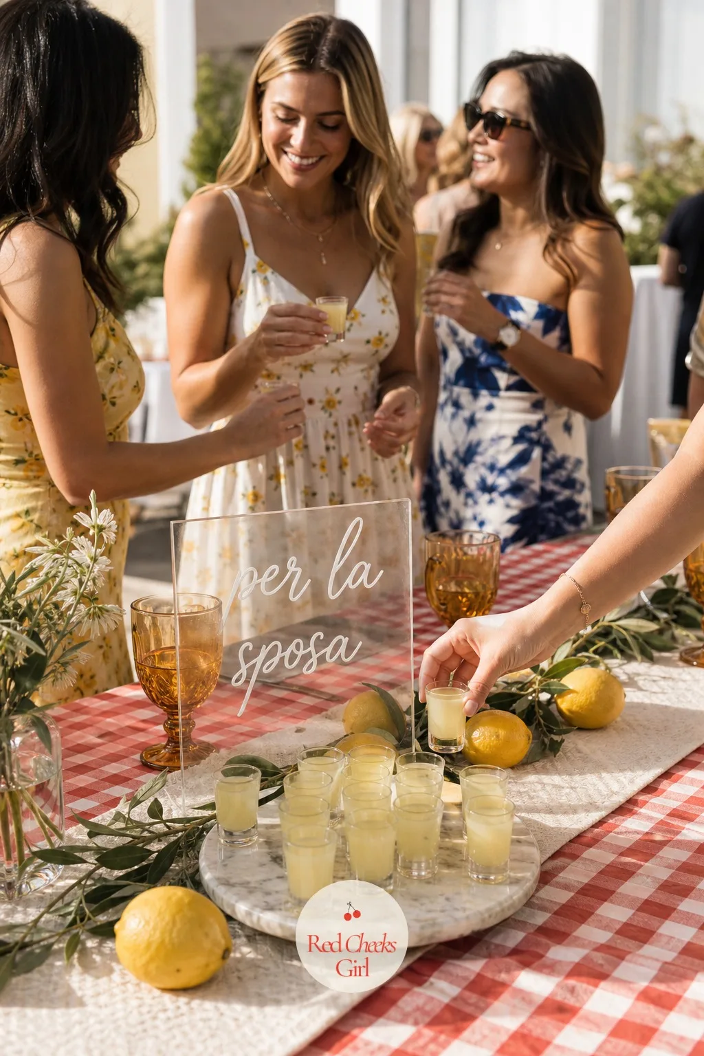 A Limoncello Toast Station — For the one moment the room goes quiet for the bride: a small tray of chilled limoncello in shot glasses, set near the spritz