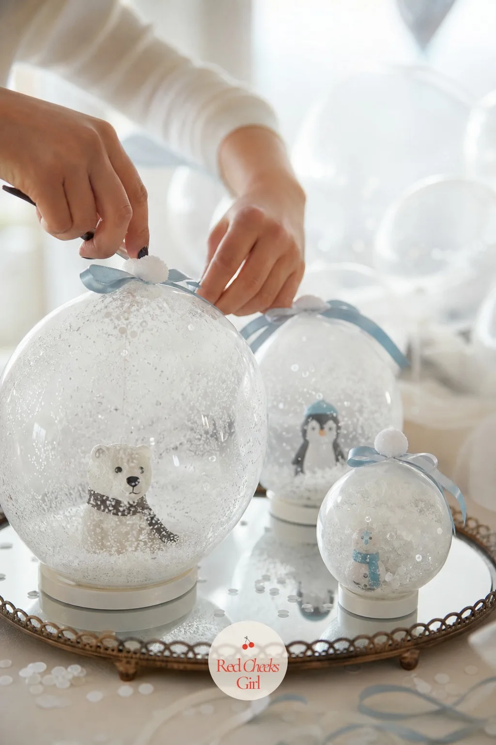 Snow Globe — Tell her to picture the party from inside the globe, not standing outside looking at it. January baby shower themes