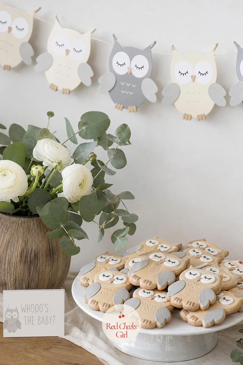 Whooo's the Baby — Owls get cartoonish fast, so keep the eyes small and the body simple: a single large paper owl garland strung above the gift table, in cream