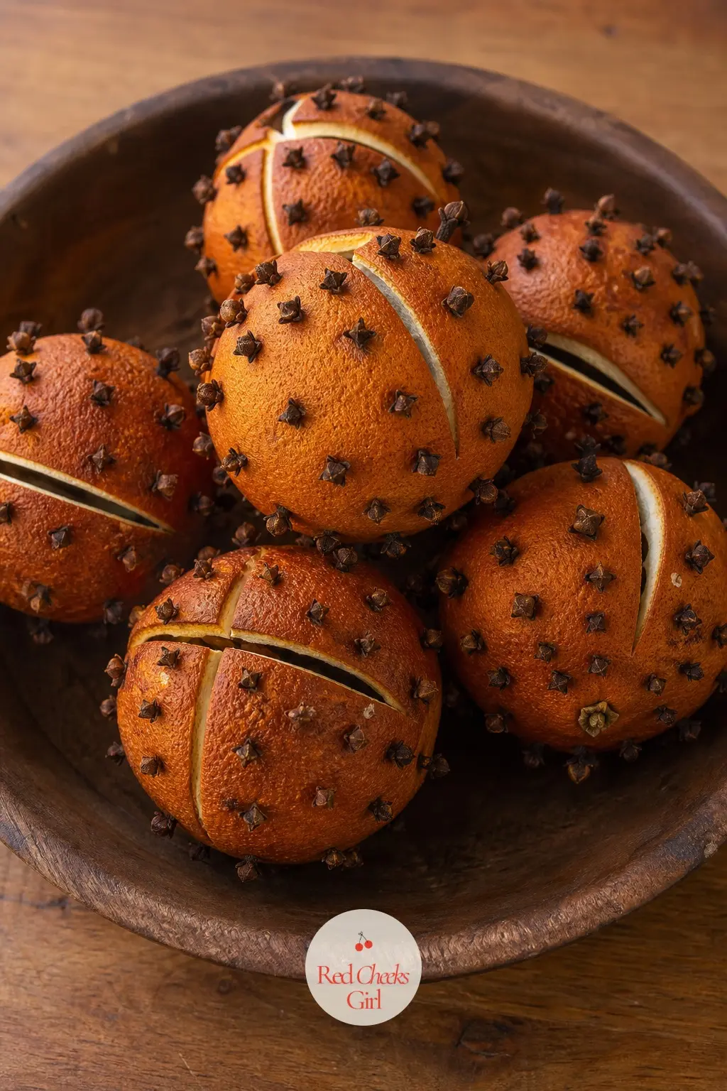 A Cluster of Dried Orange Pomanders in a Wooden Bowl — The dried orange pomanders from December do not need to retire with the rest of the holiday box. January