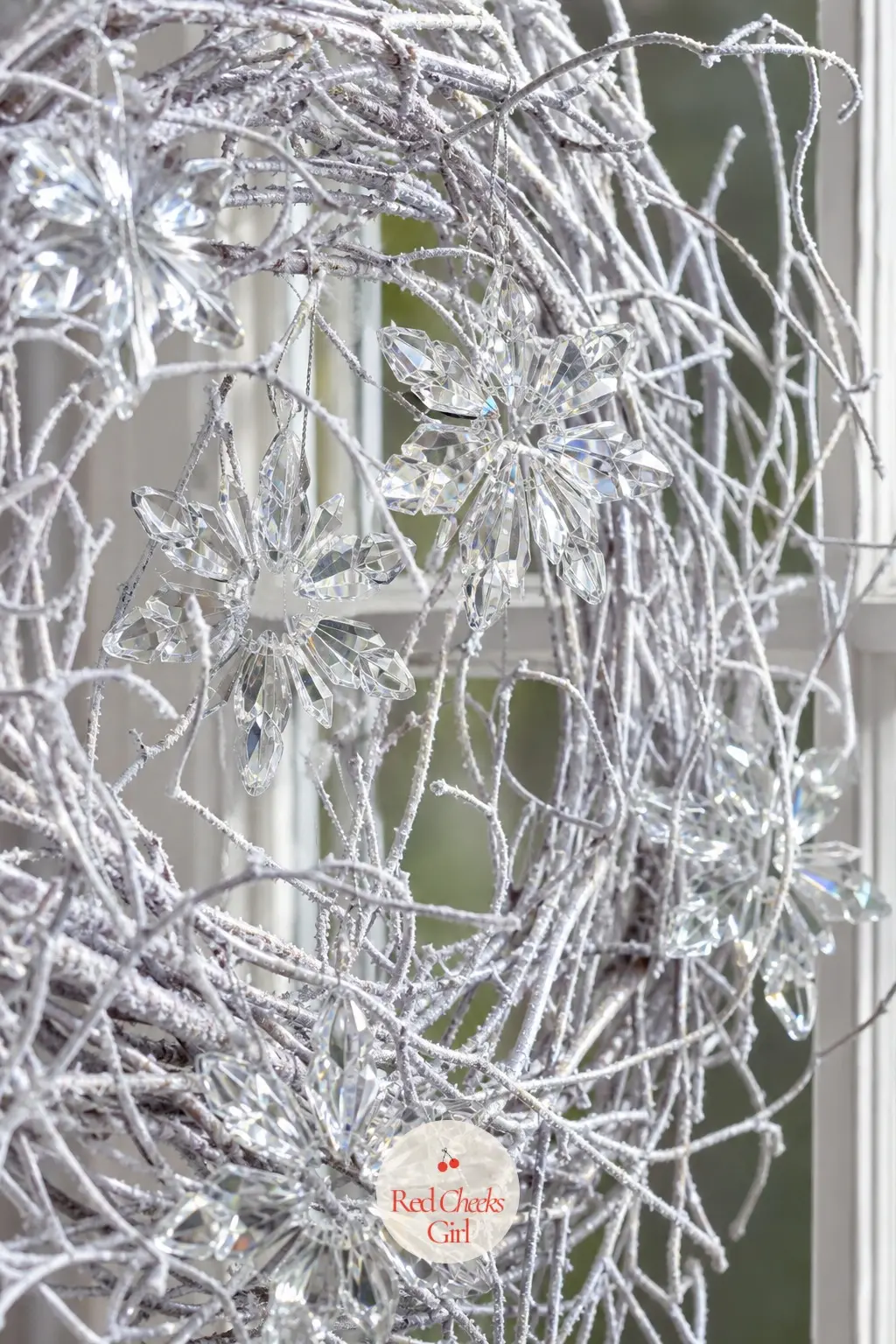 The Crystal Snowflake Ornament and Frosted Twig Wreath for the Stairway Window — Faceted crystal snowflake ornaments wired into a tangle of frosted white twigs