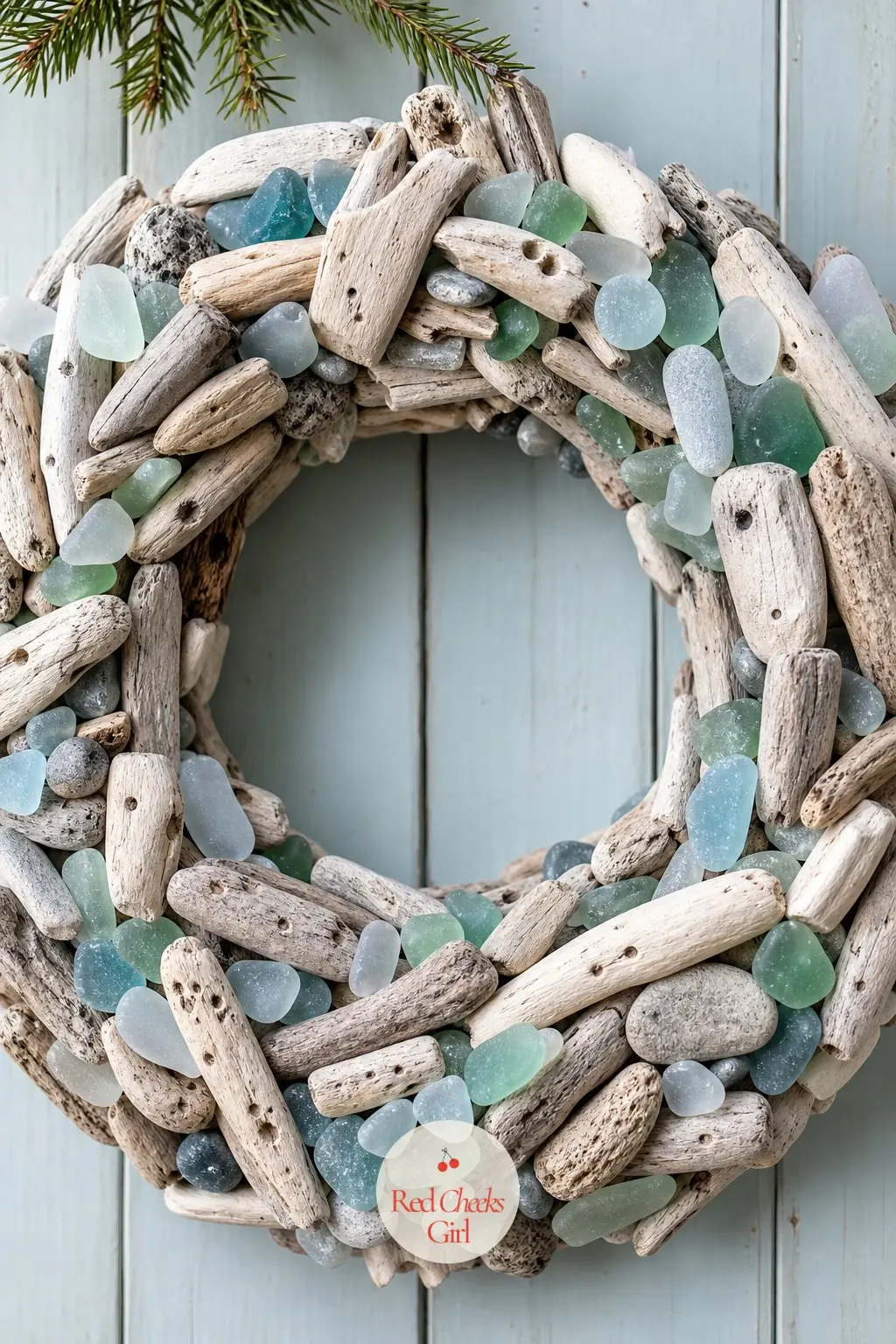 The Driftwood and Sea Glass Wreath for the Lake House Door — Small pieces of bleached driftwood glued around a wire frame, with a scattering of sea glass in