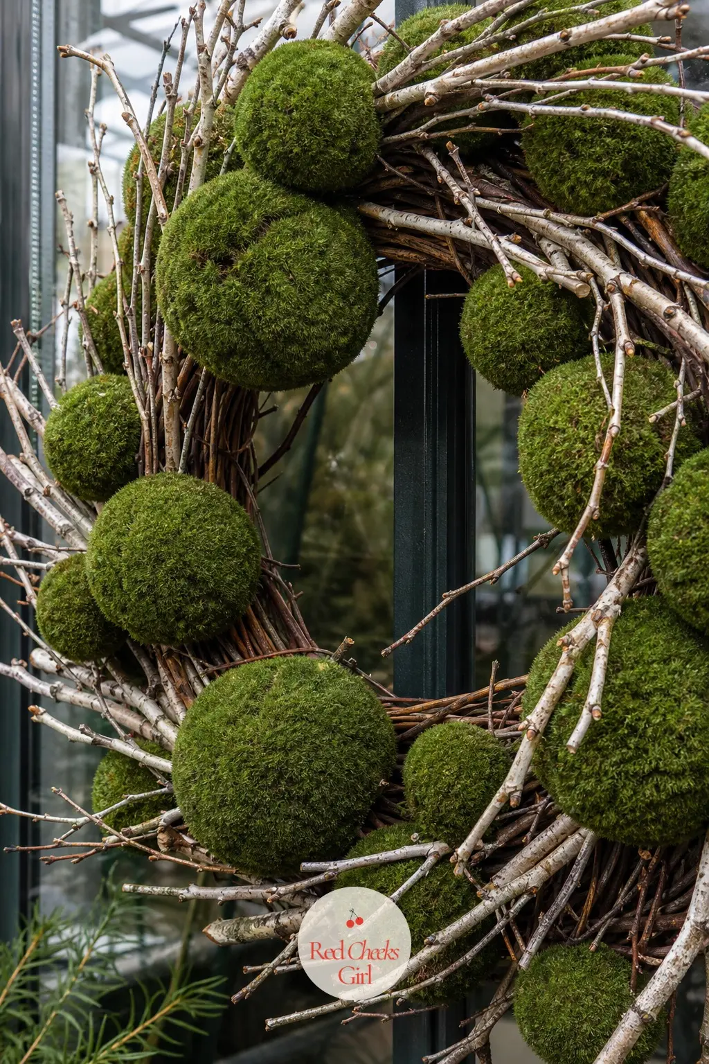 The Preserved Moss Ball and Twig Wreath for the Greenhouse Door — Round preserved moss balls tucked among bare twigs look like something foraged after a long