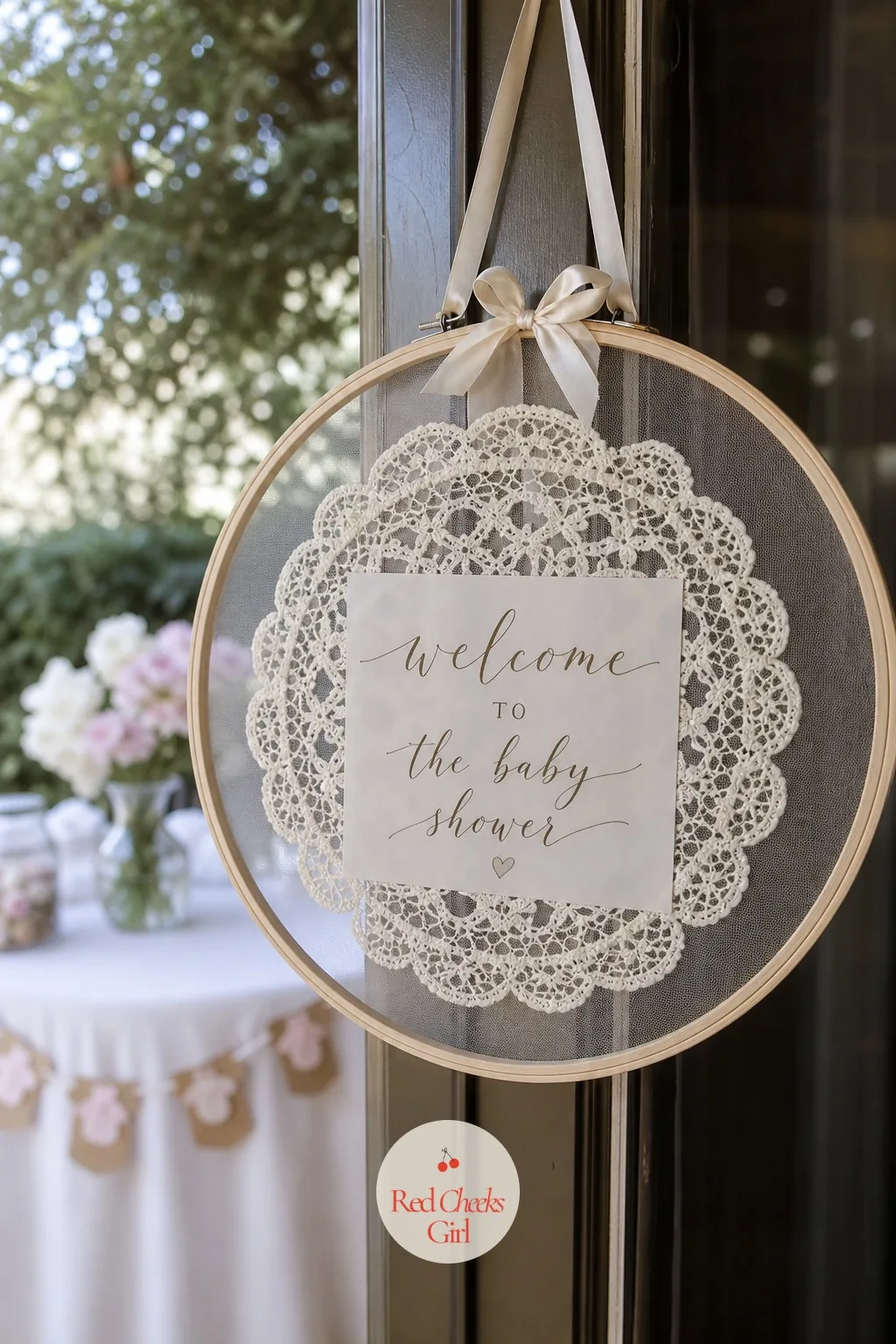 Hoop-Framed Lace Doily Welcome Sign — An easel sign needs floor space that a small apartment entry rarely has to spare. Lace baby shower ideas