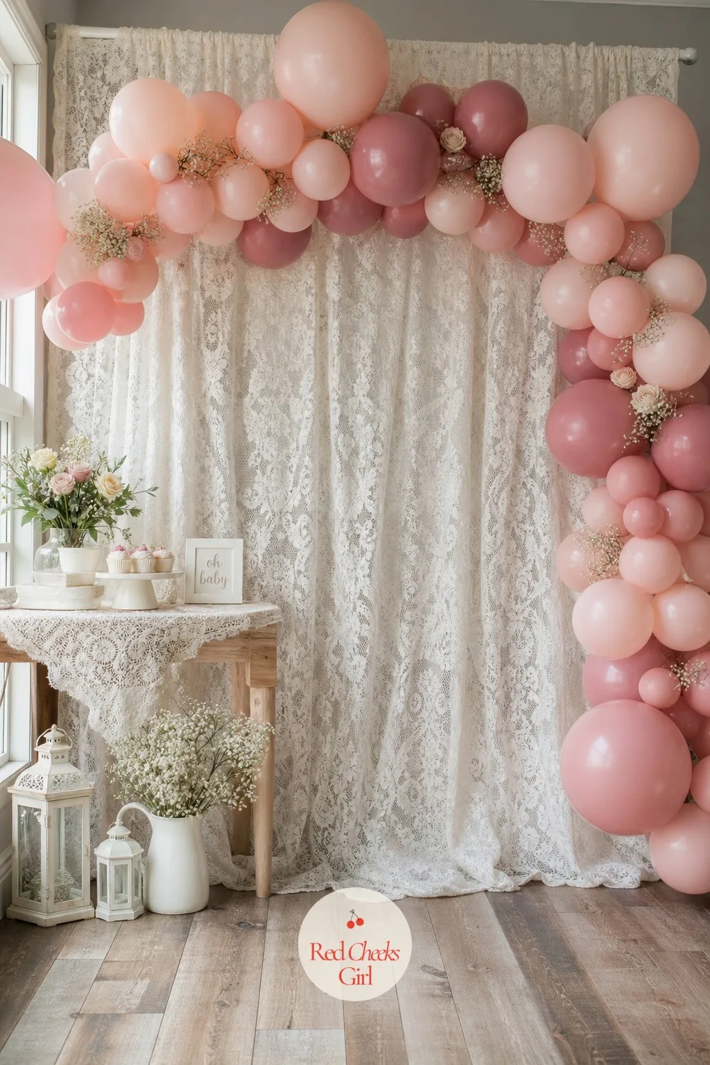 Ivory Chantilly Lace Backdrop with Blush Balloon Arch — A plain wall feels like the one thing you cannot fix without a weekend and a paintbrush. Lace baby