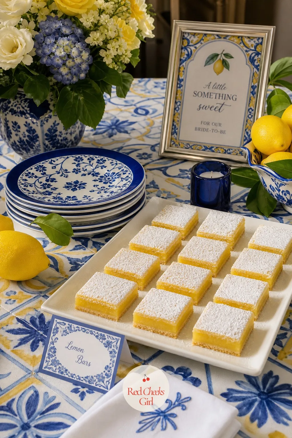 Lemon Bars on Blue and White Plates — Not every dessert needs to be fussy, and a tray of classic lemon bars dusted with powdered sugar gives guests something