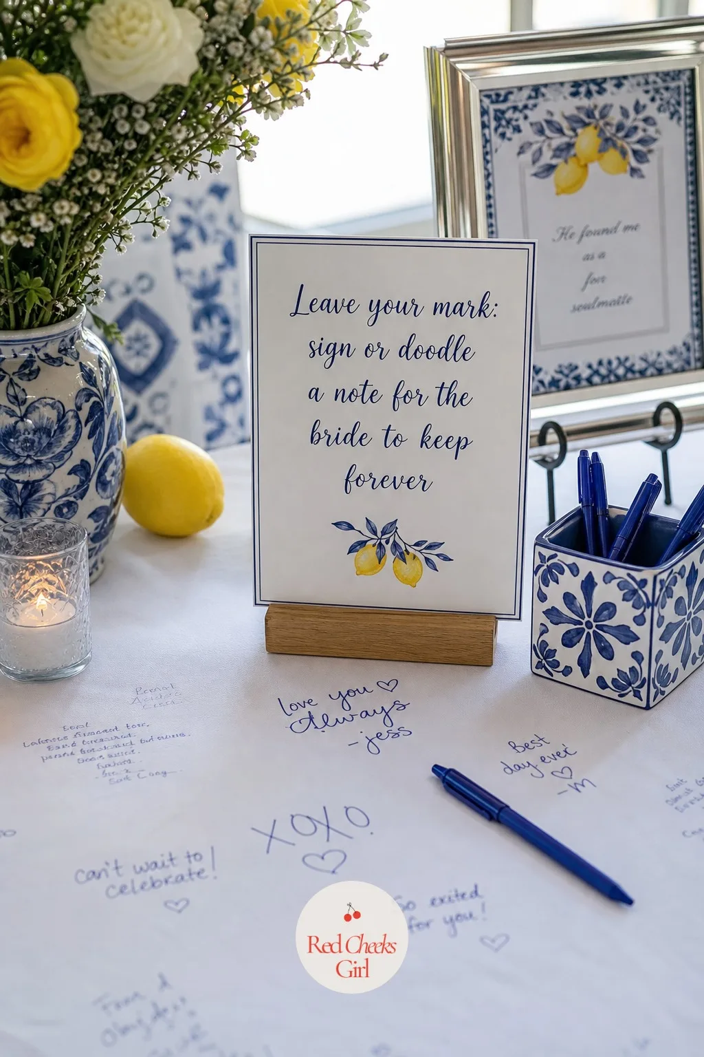 A Small Sign Explaining the Wishes Tablecloth — Nobody signs a blank cloth without being told to, and a short sign standing beside it does the explaining so