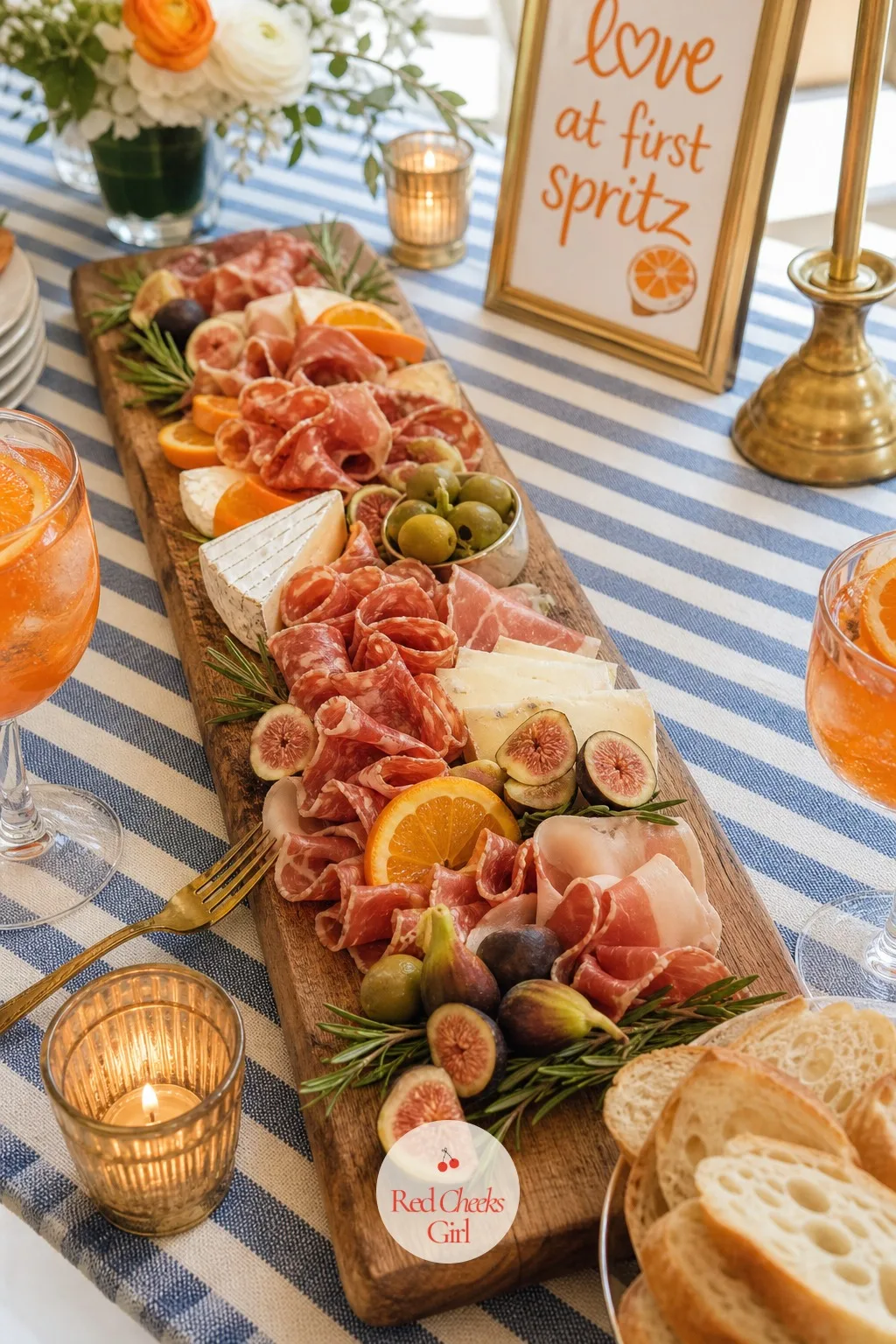 The Antipasti Board — This is the dish that does the heavy lifting of feeding everyone without a single hot plate: a long wooden board laid flat on the table