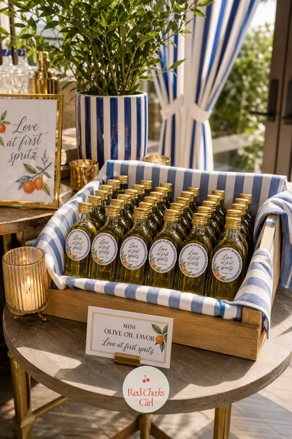 The Mini Olive Oil Favor Bottles — Set in a low wooden crate beside the candles, these give guests something to actually cook with rather than display: a small