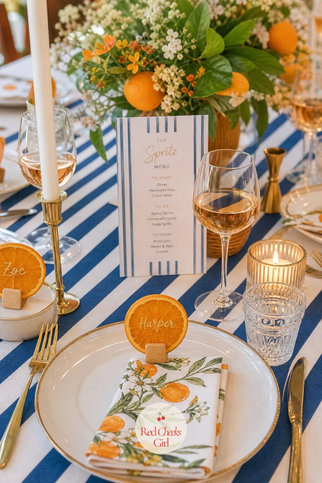 The Place Cards Tucked Into Orange Slices — Guests scanning the table for their seat deserve a detail that makes them smile before they even sit down: a dried