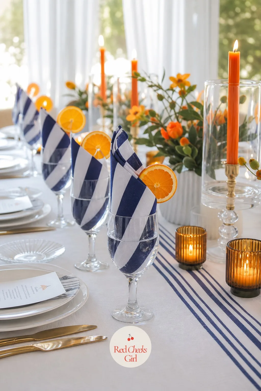 The Striped Napkins — A napkin seems small until it is folded into a glass at every single place setting, and suddenly the whole table has a rhythm: navy and