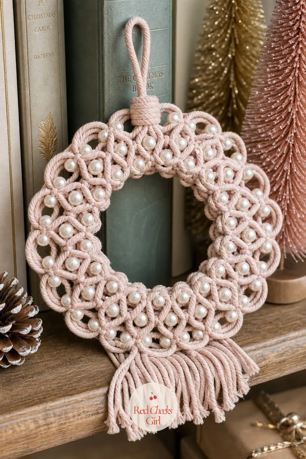 The Blush and Pearl Macrame Wreath for the Bookshelf — Small enough to tuck between stacked books rather than hang anywhere, this wreath pairs blush pink cord