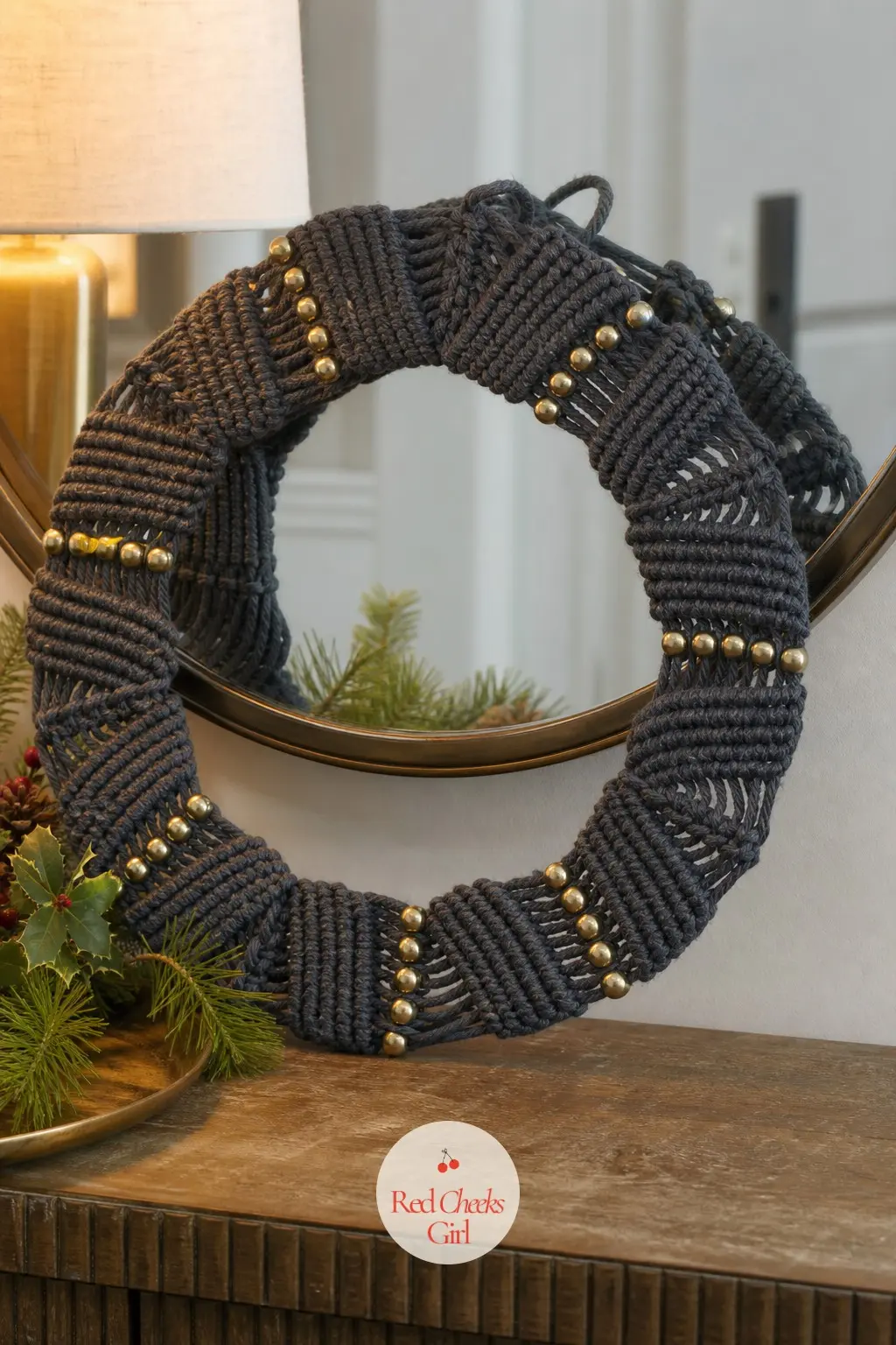 The Charcoal and Brass Macrame Wreath for the Entry Table — A sharper look for anyone whose entry runs more moody than cosy: charcoal cord knotted into a