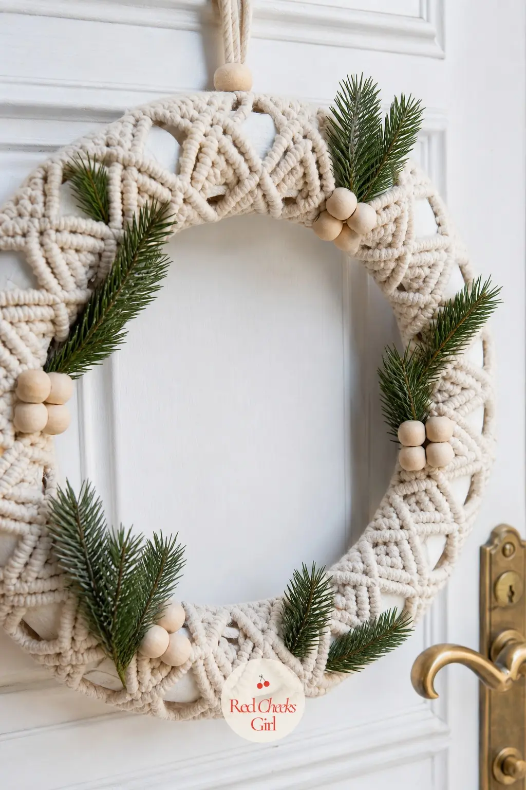 The Cream and Pine Green Macrame Wreath for the Front Door — Cream cotton cord, knotted into a diamond pattern on a wood ring, with a scatter of natural wood