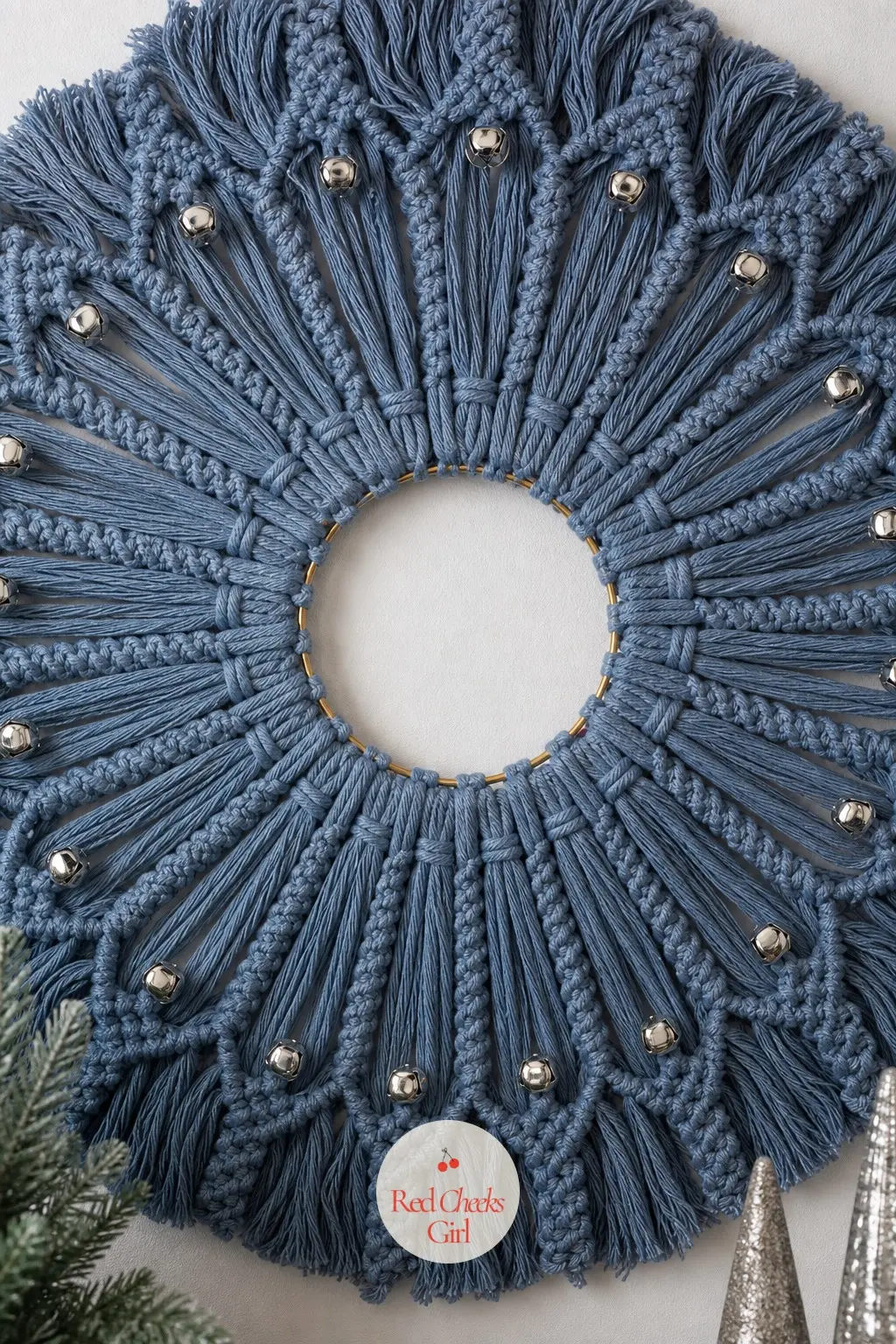 The Dusty Blue and Silver Macrame Wreath for the Living Room Wall — This one is less a wreath than a piece of wall art: dusty blue cord fanned out in rows of