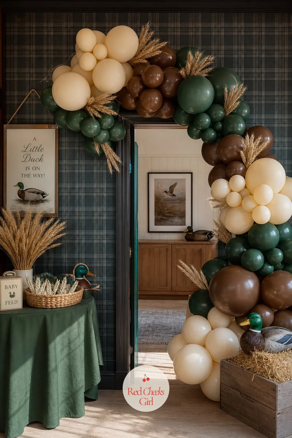 Forest and Chestnut Balloon Arch with Wheat Stems — A balloon arch can tip into birthday-party territory fast, all primary colors and shine. Mallard duck baby