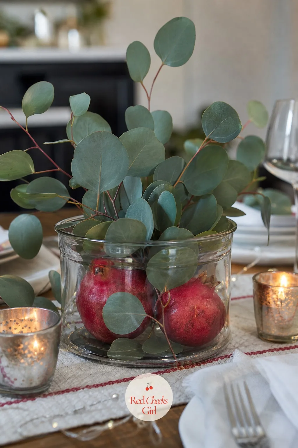 Pomegranate and Eucalyptus Centerpiece Jar — Fresh greenery alone on a table can look a little bare by dessert, once the eye has taken it in once. Mason jar
