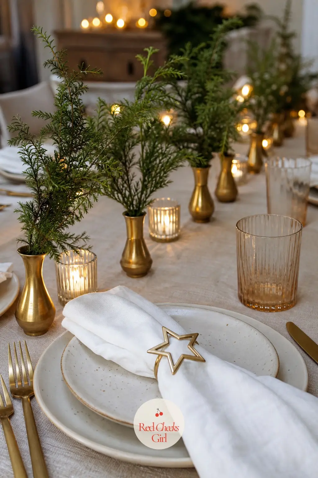A Low Line of Bud Vases Down the Centre — Instead of one tall centrepiece that blocks the table in half, set a low line of small brass bud vases down the