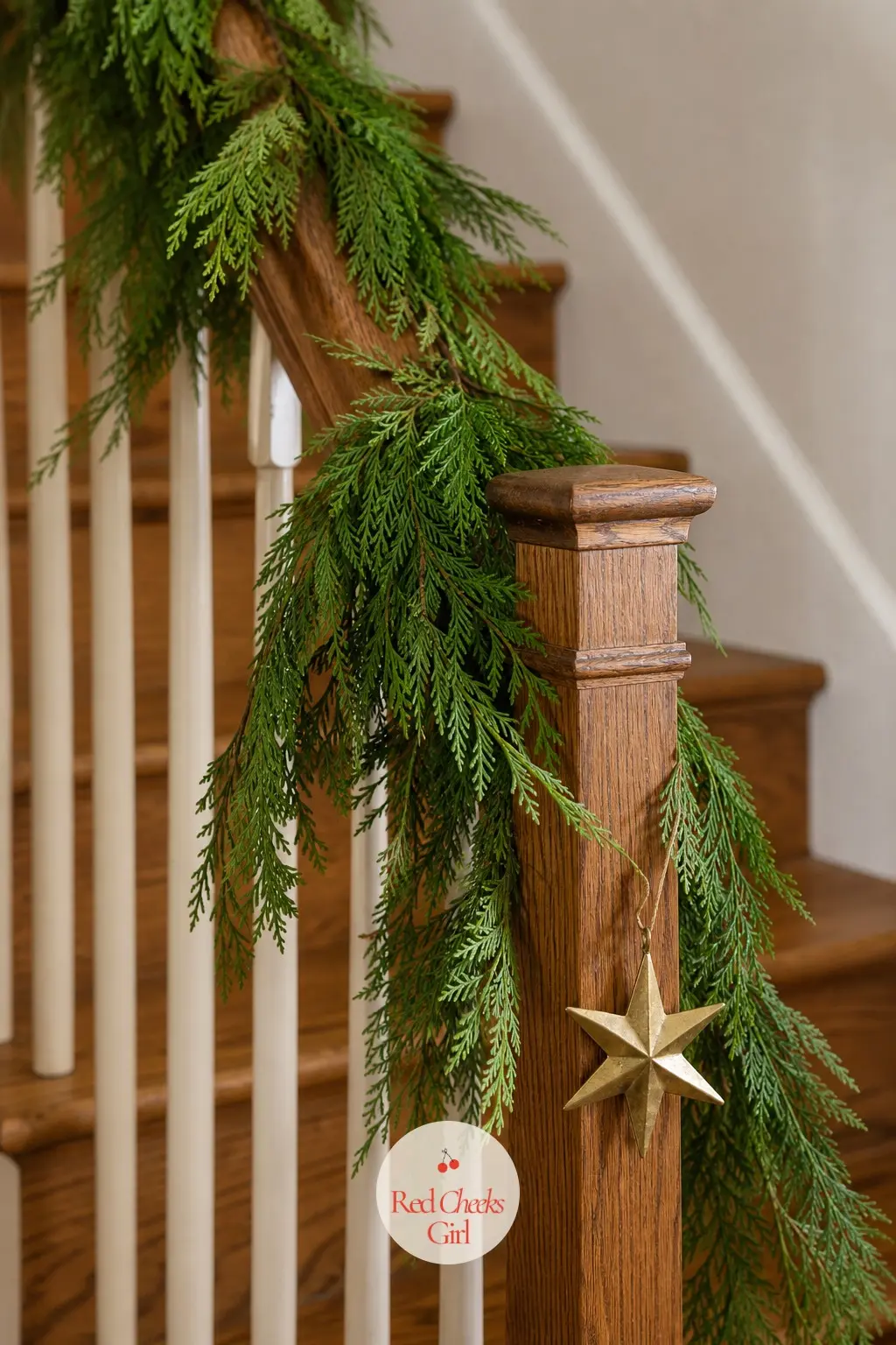 One Simple Strand Along the Banister — A single length of fresh cedar, wound loosely along the handrail without a single bow or cluster weighing it down, lets