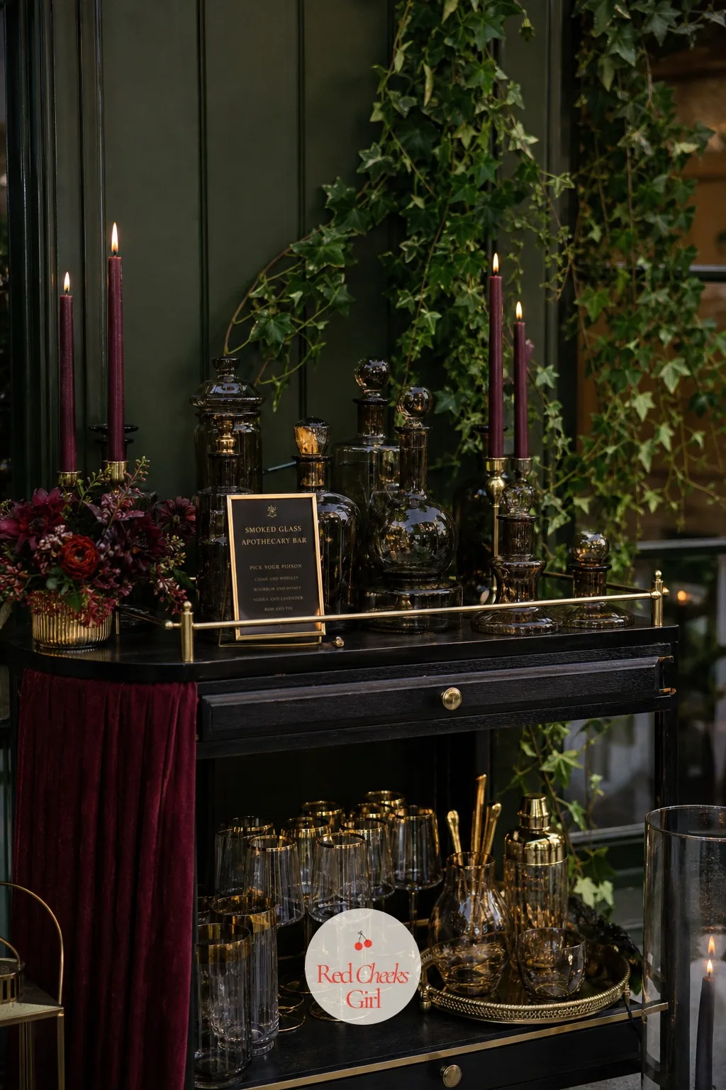 Smoked Glass Apothecary Bar — A bar cart with clear bottles and standard glasses looks like any hotel function room, which is the last thing this reception