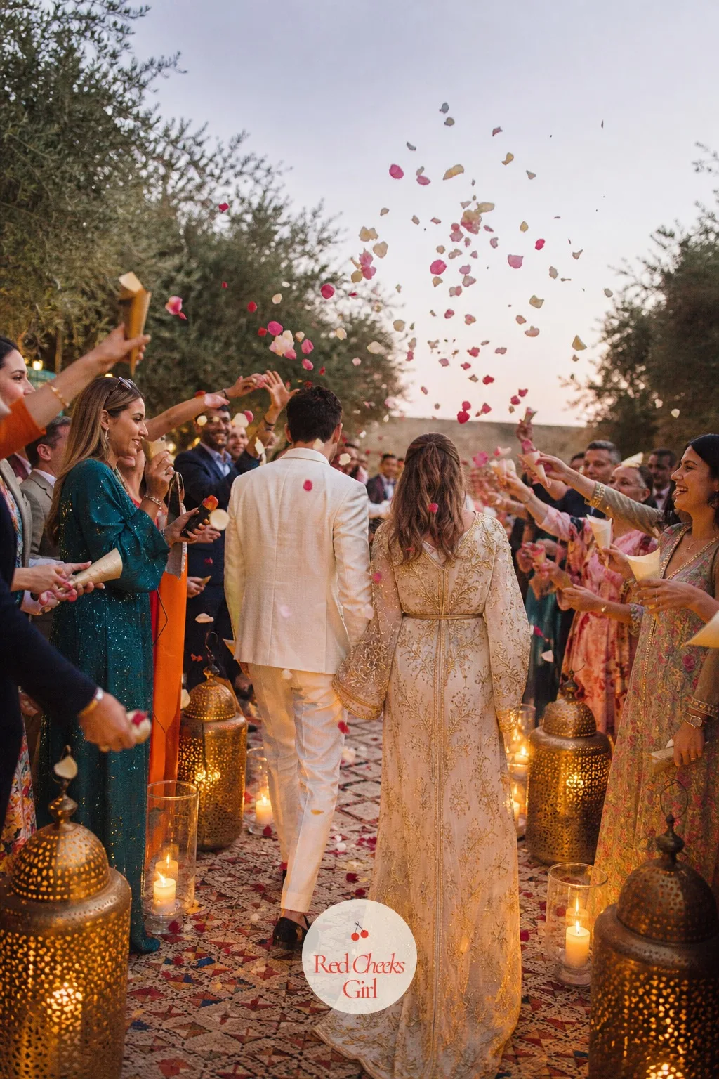 A Rose Petal Send Off — Confetti cannons feel wrong against a day built on real roses and brass. Moroccan wedding