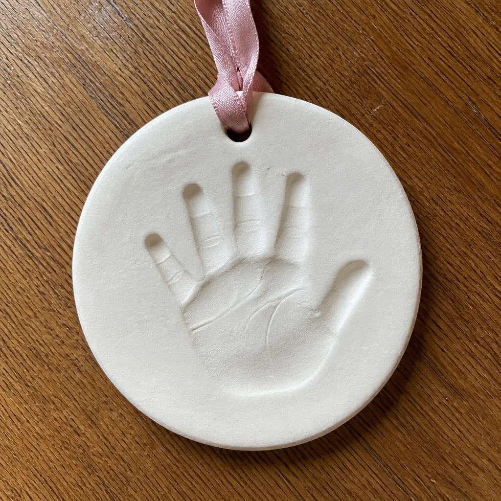 Handprint Ornament Kit — A clay kit for pressing a grandchild's hand or footprint into an ornament she hangs every single year. Mother in law christmas gift