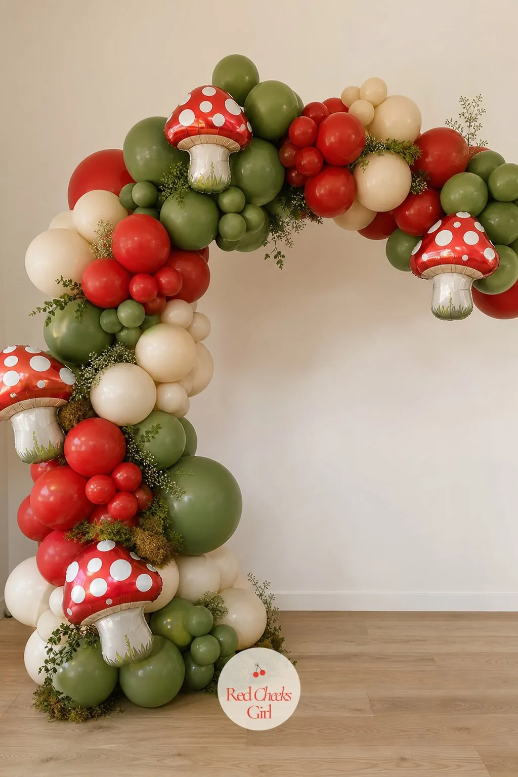 Red and Moss Balloon Arch — An arch gives the room a focal wall without a single nail going in, which matters if the venue is rented or the wall is someone