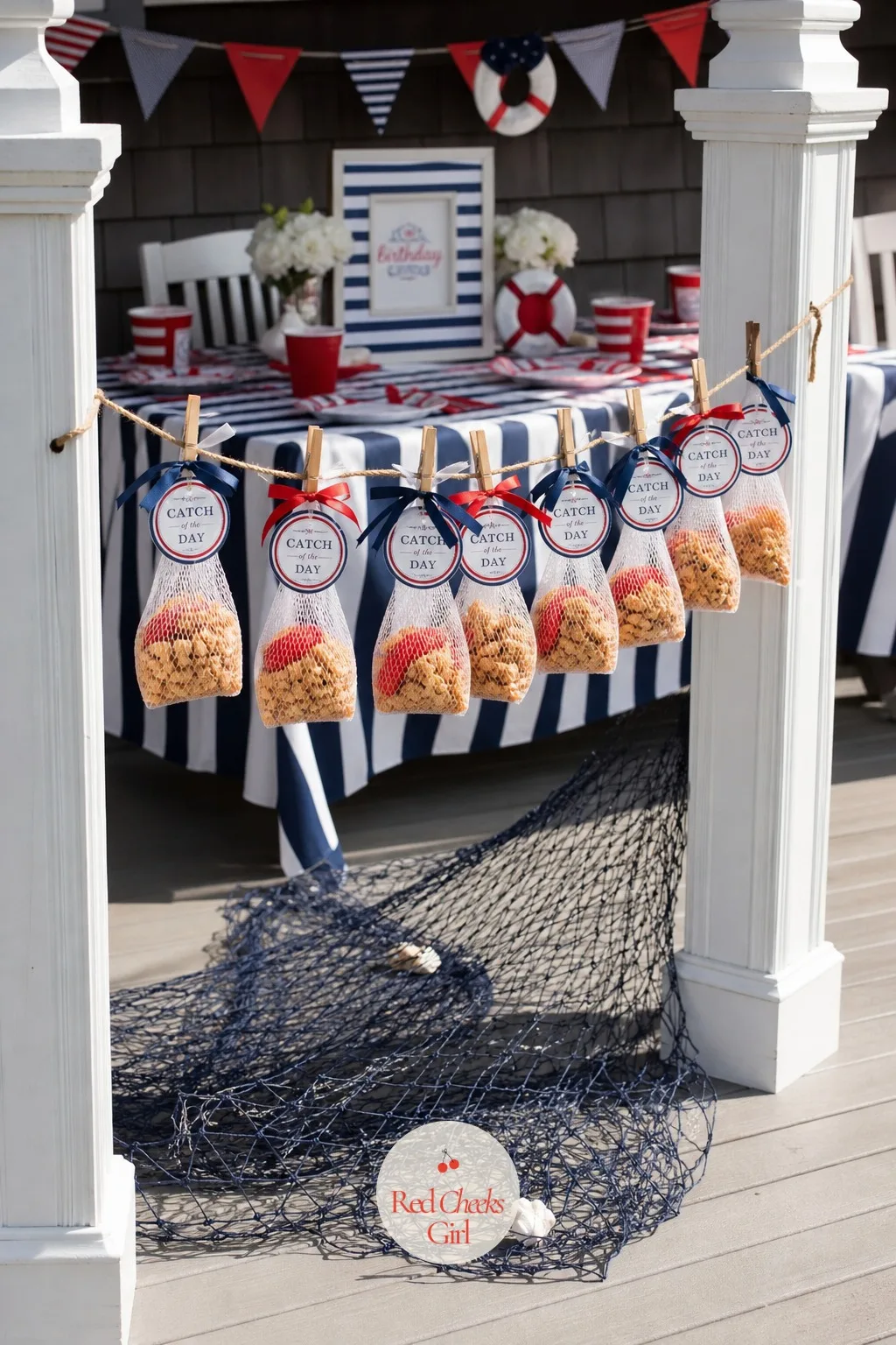 Catch of the Day Treat Nets on a Line — A table of favour bags disappears into everything else sitting on it. Nautical birthday party