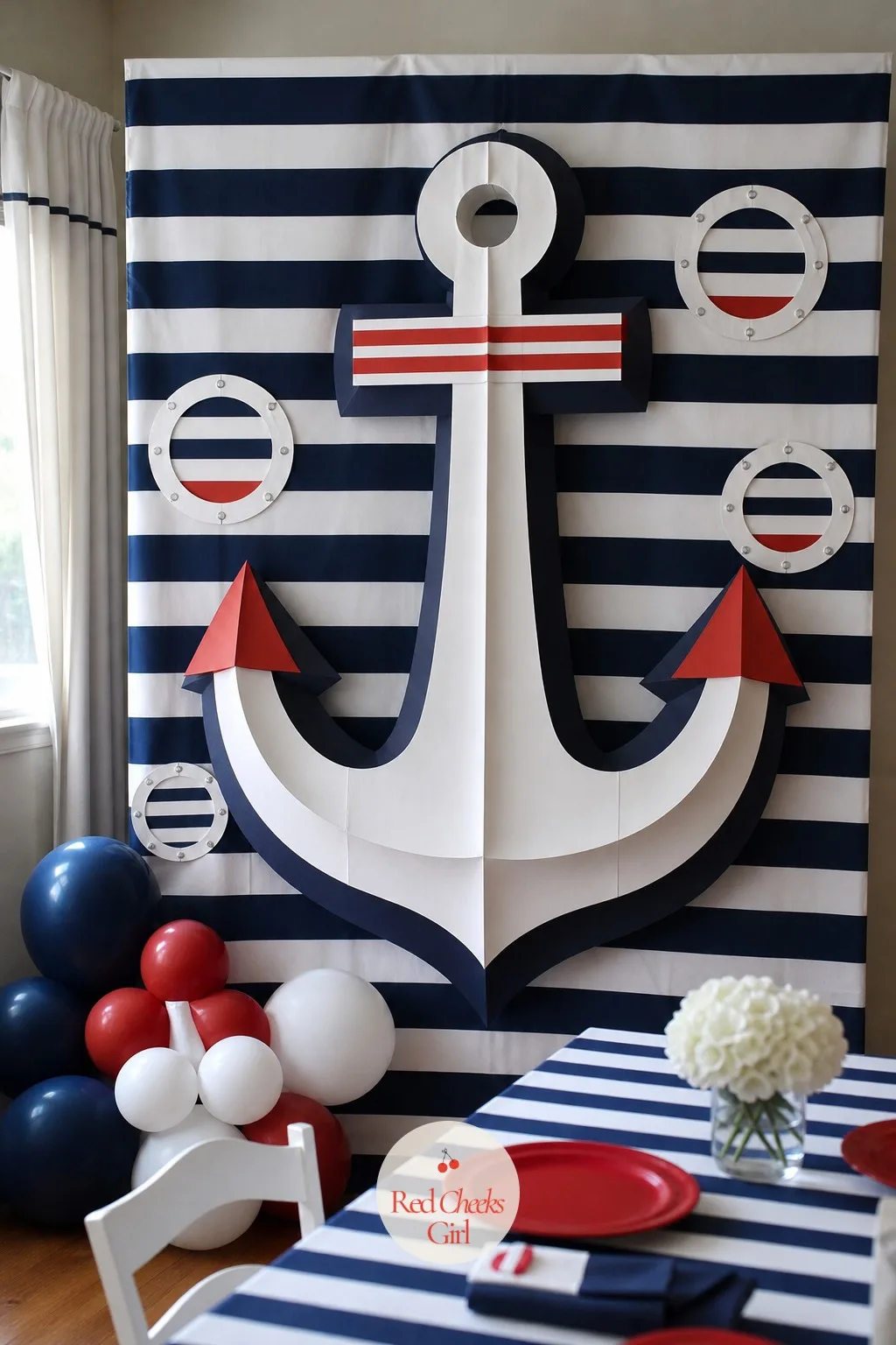 A Photo Corner with a Giant Paper Anchor — Somewhere in the room needs to hold still long enough for a photo, a spot that is not the food table and not the